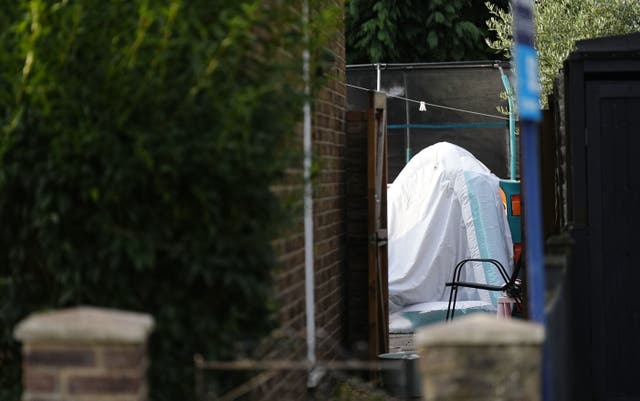 Three children and man found dead in Surrey house | The Independent