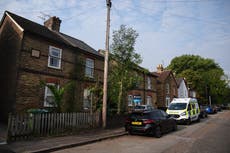 Three children and man found dead in Surrey house