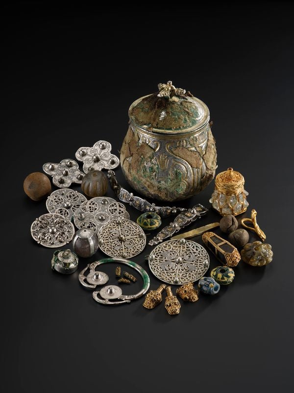 The Galloway Hoard vessel and the items discovered within. It is estimated to be around 1,100 years old. (National Museums Scotland/PA)