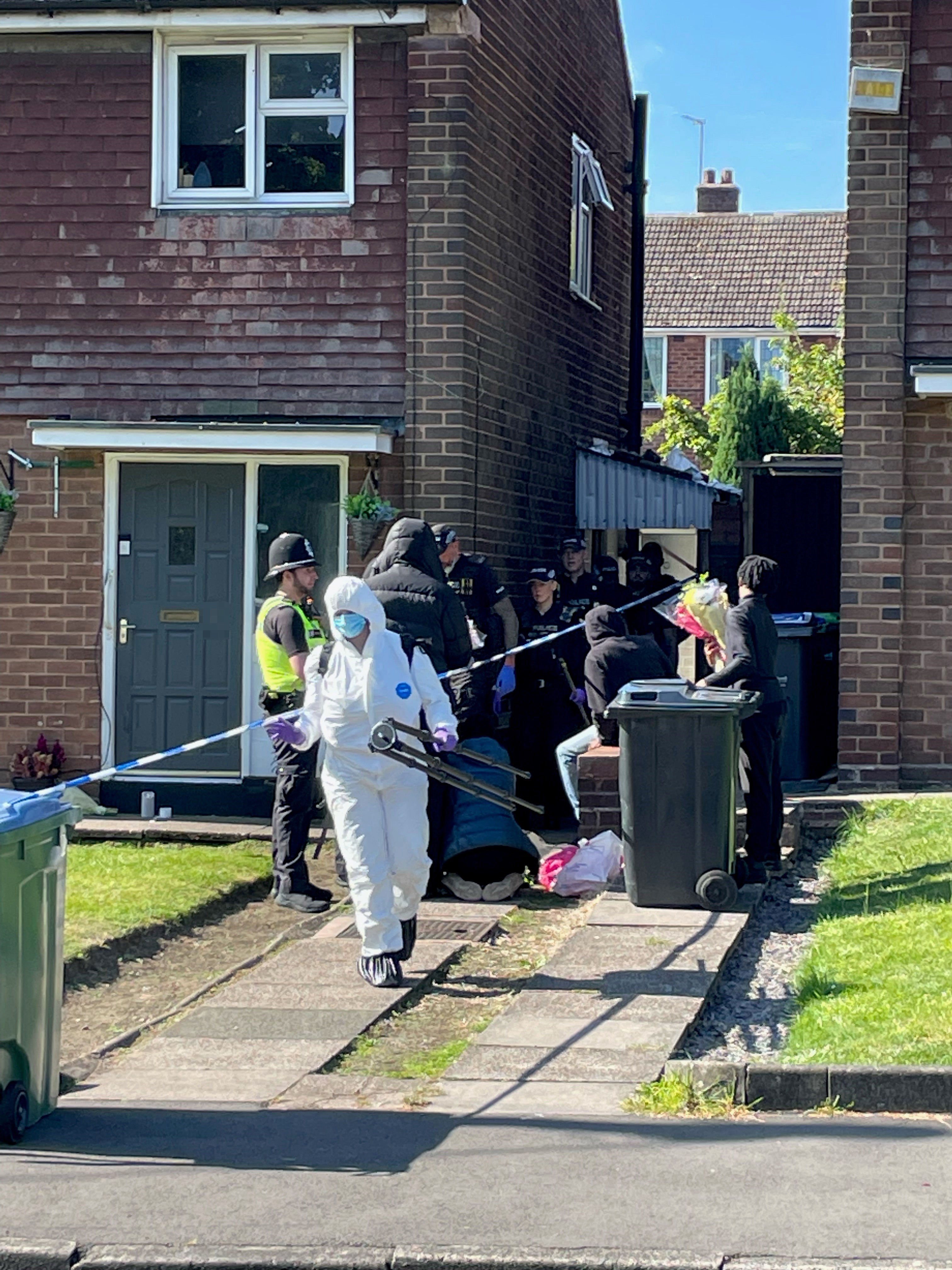 Police officers at the scene in Lovett Avenue, Oldbury