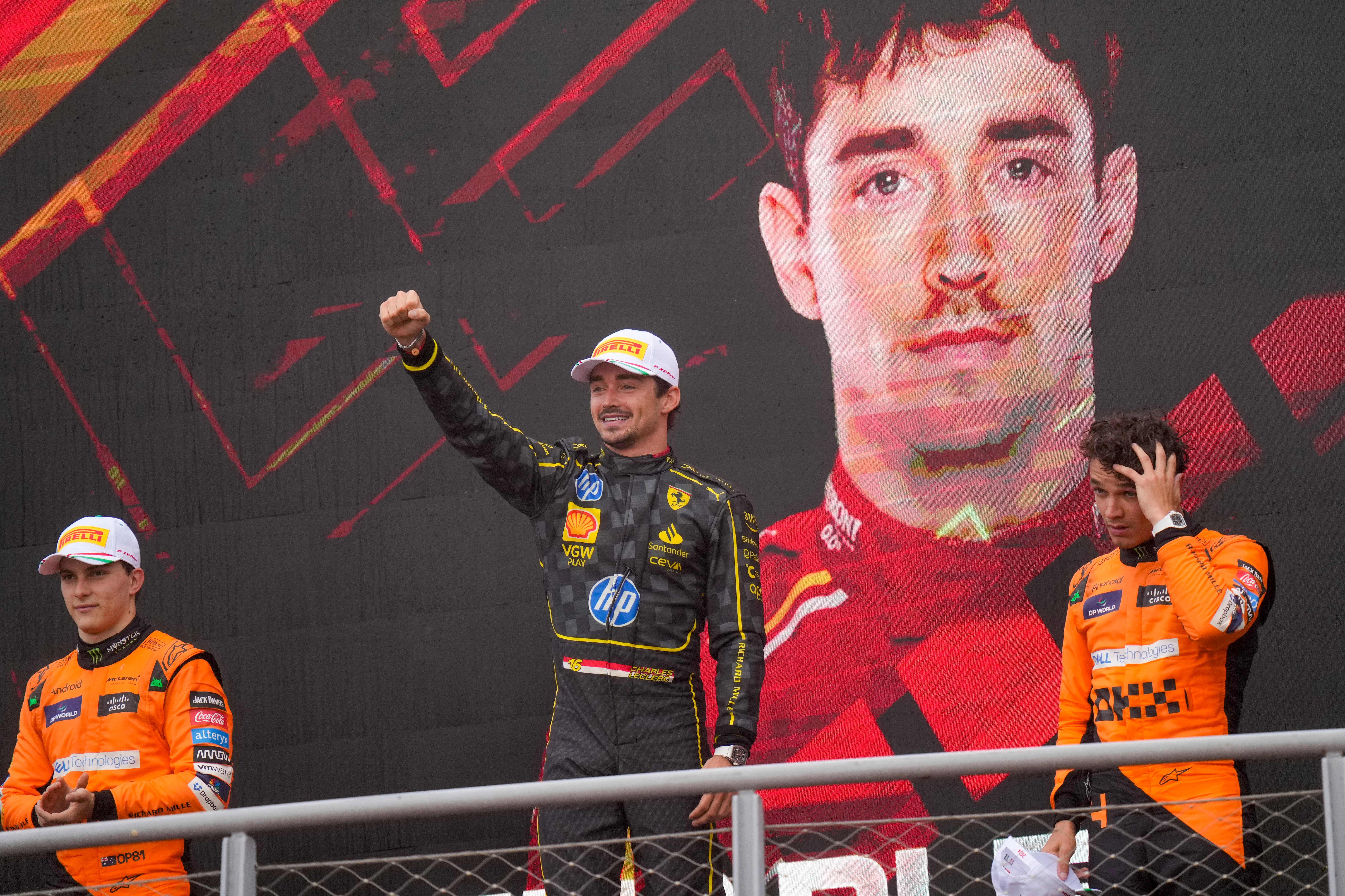 Charles Leclerc celebrates his win on the Monza podium