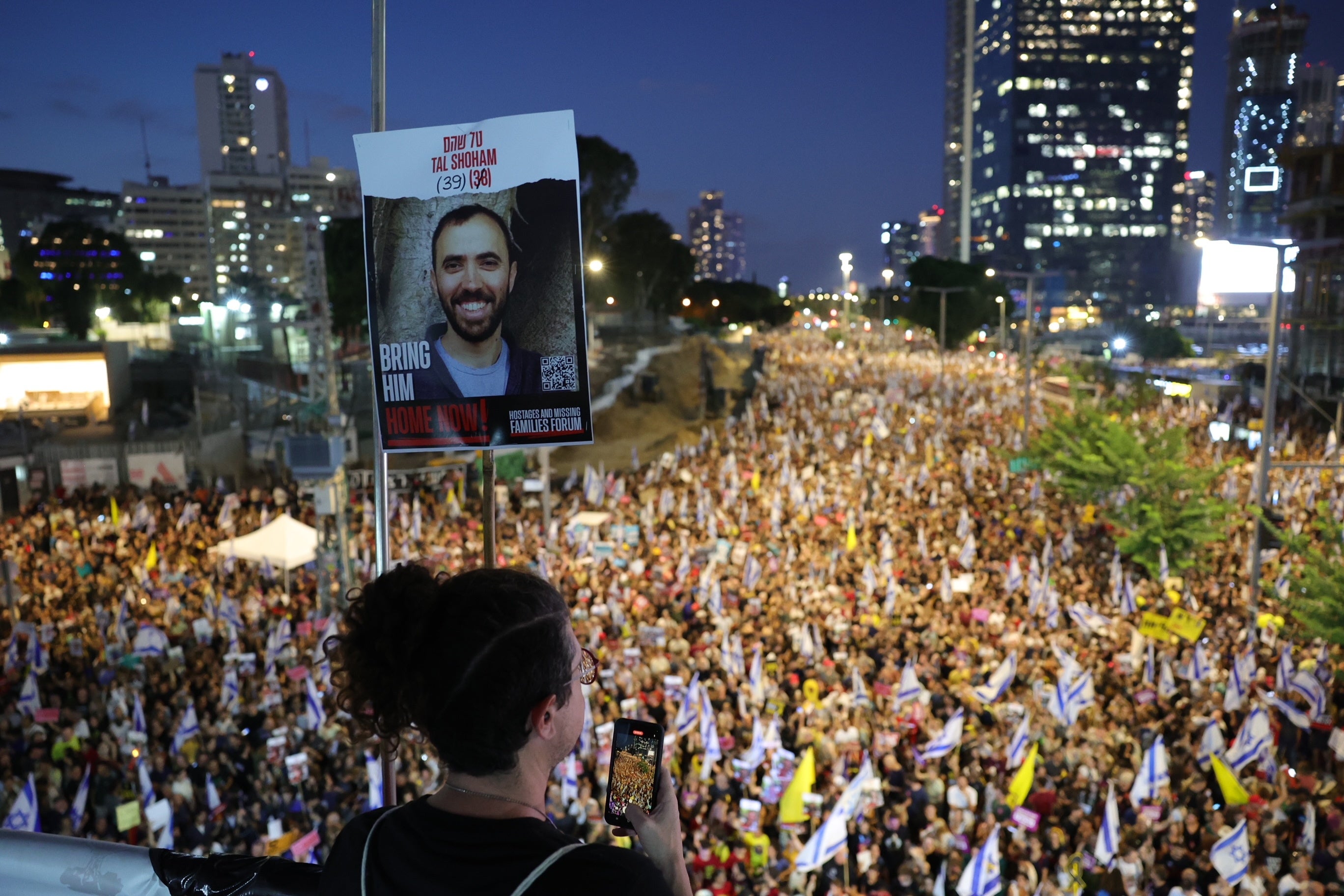 Thousands of demonstrators in support of the families of Israeli hostages take part in a protest rally outside the Kyria military headquarters in Tel Aviv