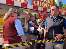 It's a pork chop on a stick and a vanilla shake for Tim Walz at the Minnesota State Fair