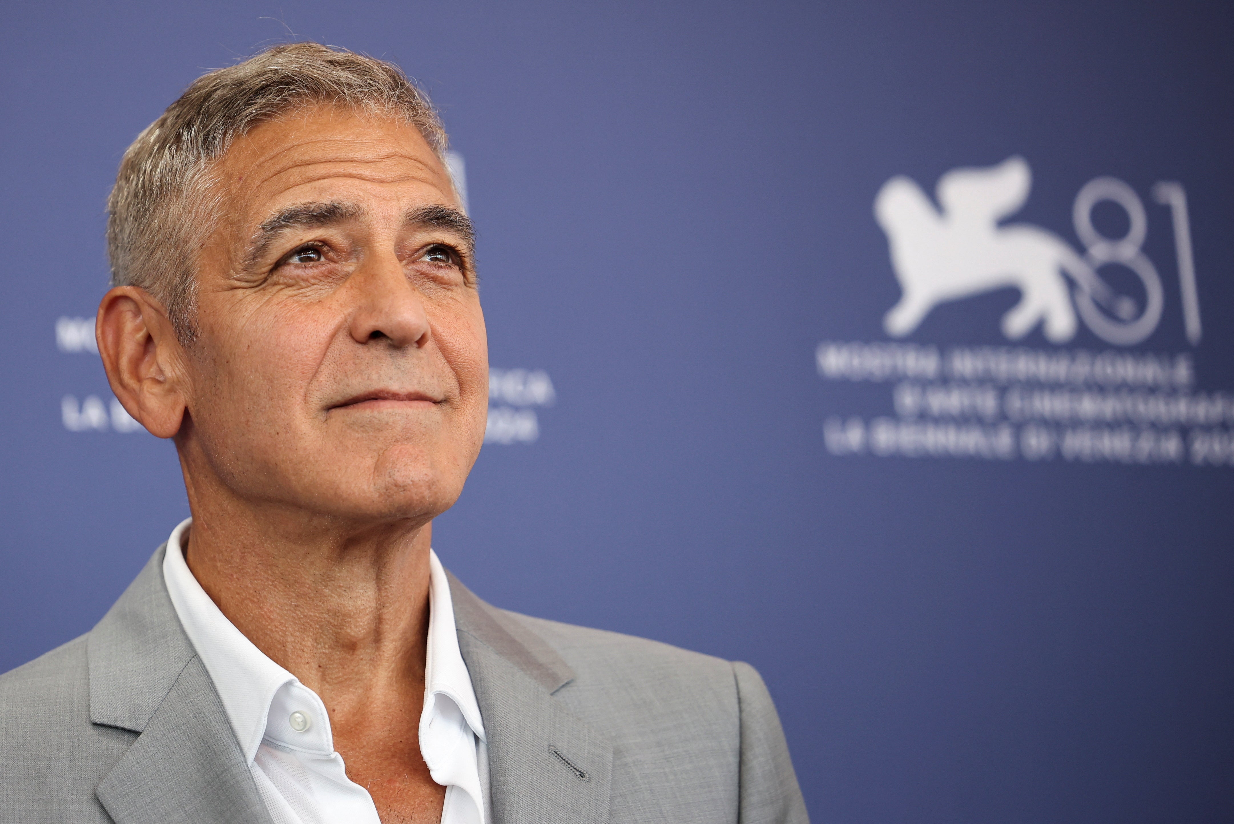 George Clooney poses during a photocall for the movie ‘Wolfs.’ He has praised Biden’s ‘selfless act’ of dropping out of race