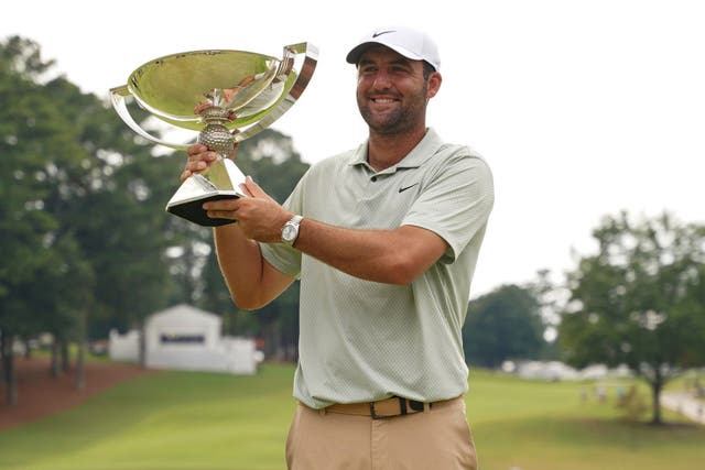 Scottie Scheffler with the FedEx Cup after his victory in Atlanta (Jason Allen/AP)