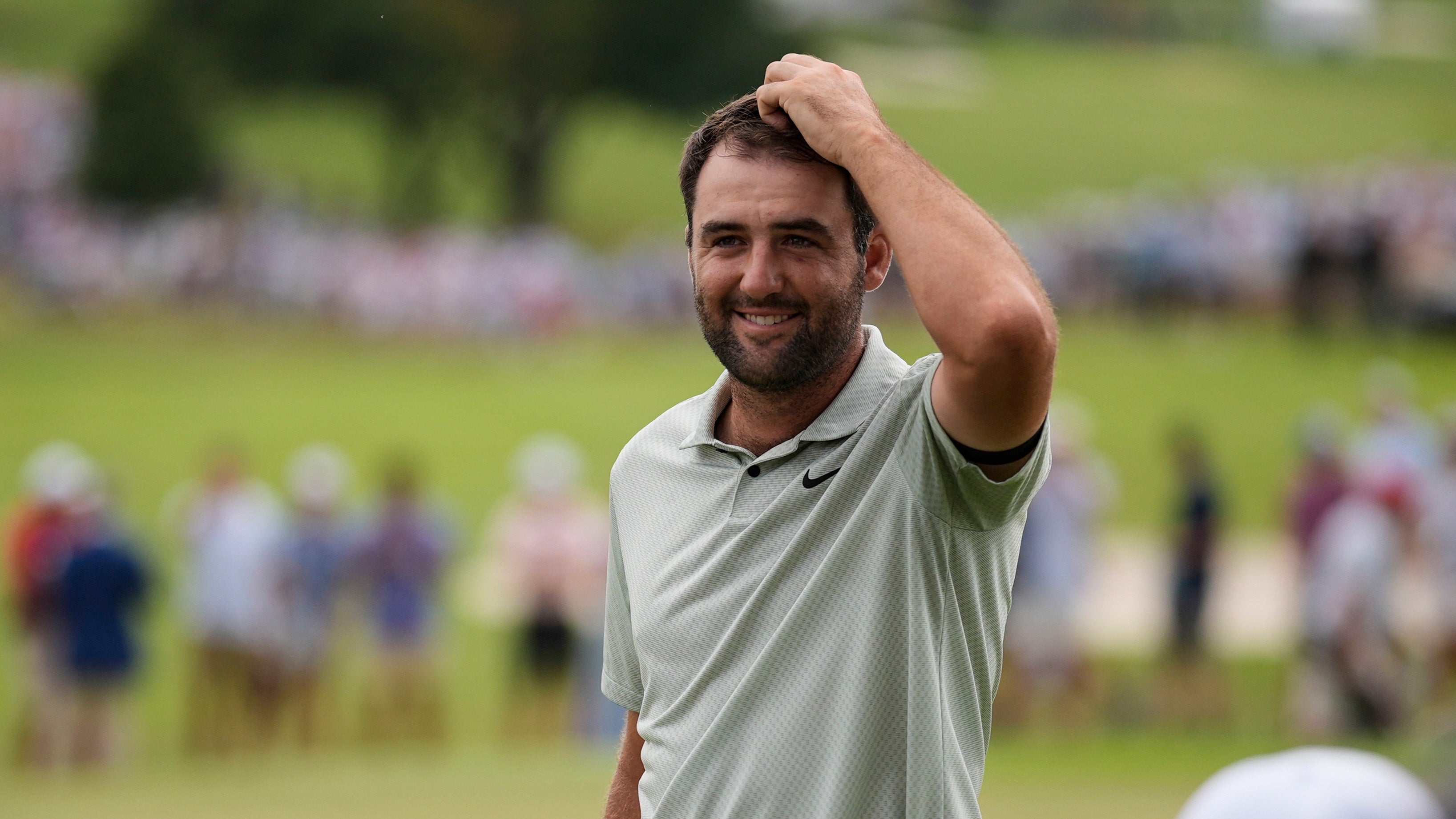 Scottie Scheffler celebrated after winning the Tour Championship in Atlanta (Mike Stewart/AP)