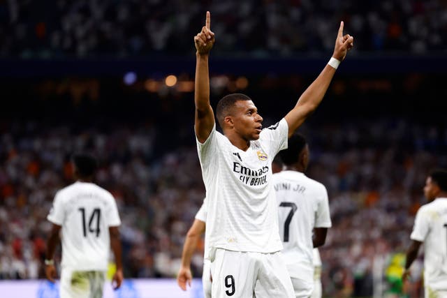 Kylian Mbappe celebrates after scoring in Real Madrid’s 2-0 win over Real Betis (Pablo Garcia/AP)