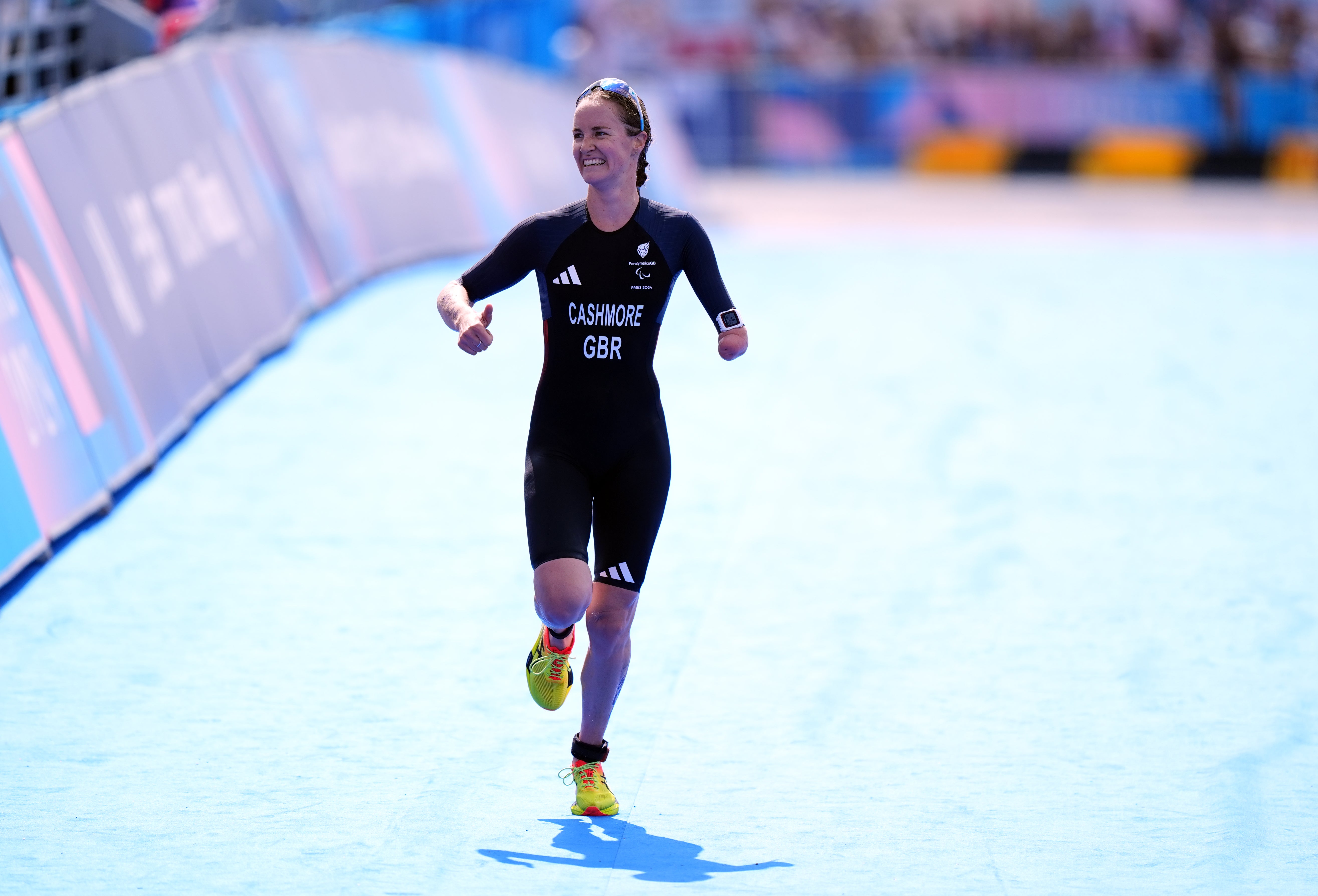 Claire Cashmore celebrates as she approaches the finish line