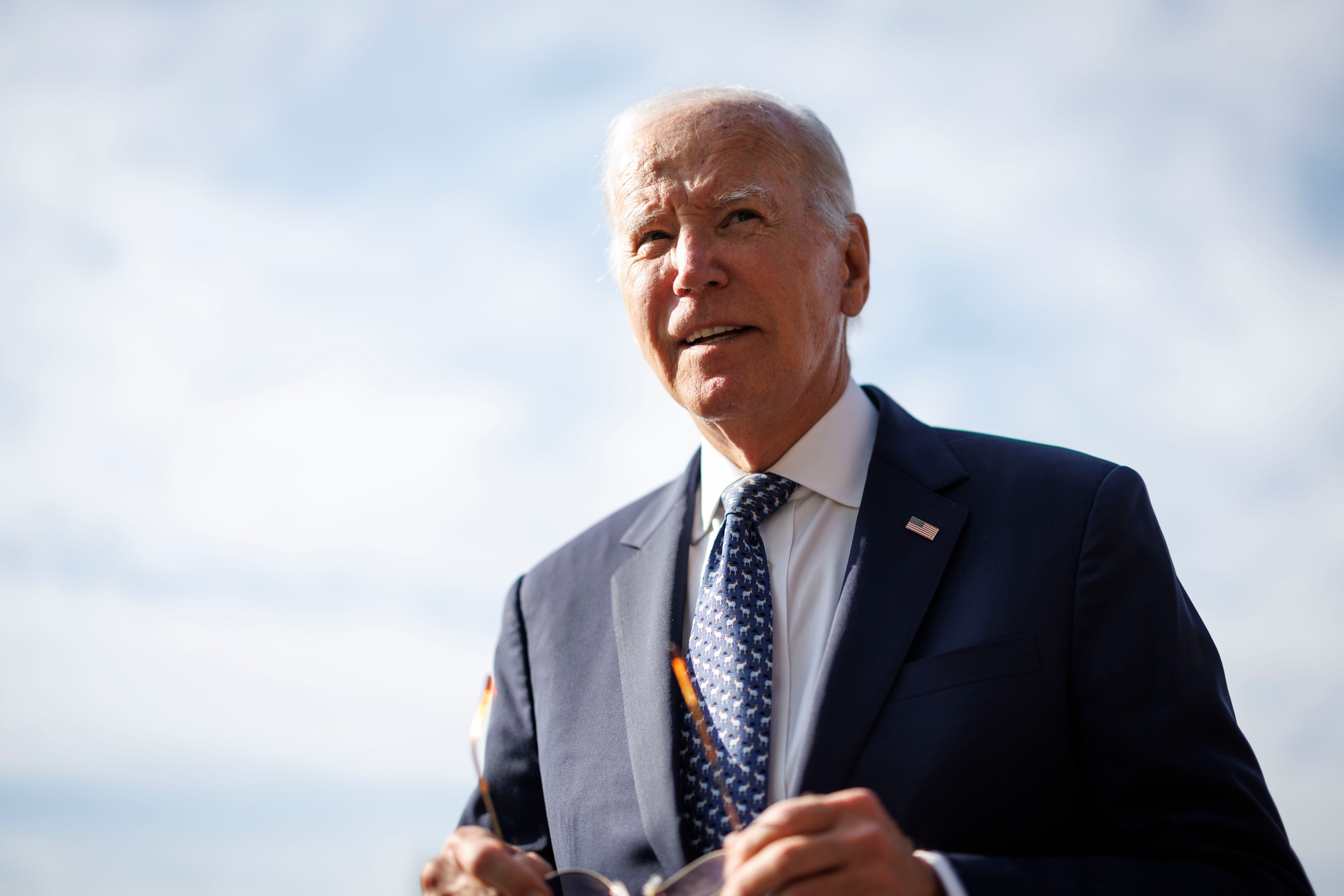 US President Joe Biden speaks to members of the media on the South Lawn of the White House after arriving on Marine One in Washington