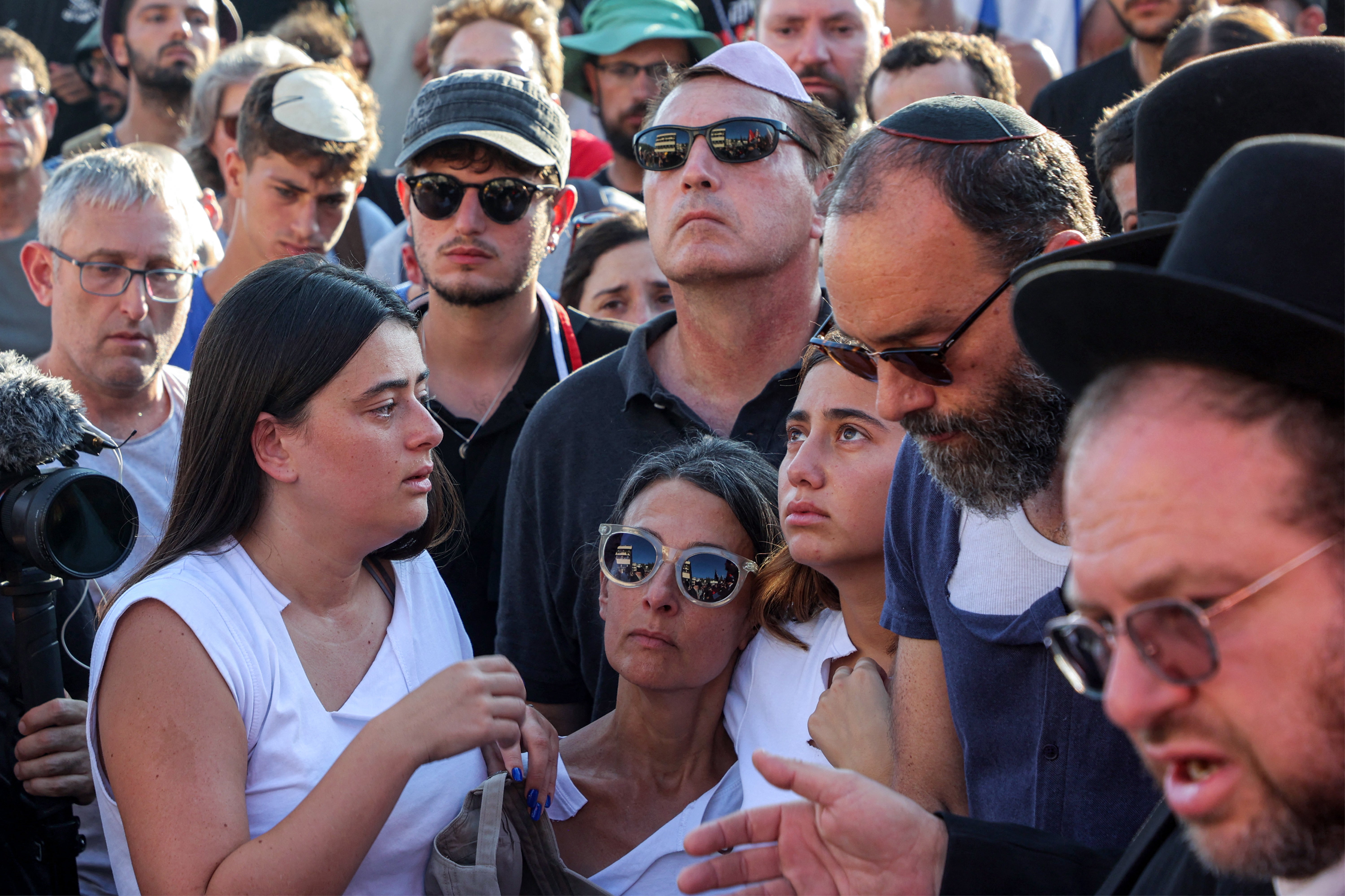 Jonathan Polin (2nd-R) and Rachel Goldberg (4th-R), parents of killed US-Israeli hostage Hersh Goldberg-Polin whose body was recovered with five other hostages in Gaza, attend the funeral in Jerusalem