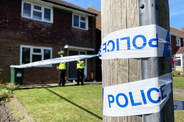 Police officers at the scene in Lovett Avenue, Oldbury after a 13-year-old boy was stabbed to death (Phil Barnett/PA)