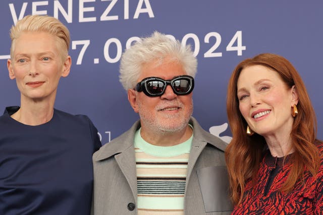 <p>Pedro Almodóvar (centre) with ‘The Room Next Door’ stars Tilda Swinton and Julianne Moore</p>