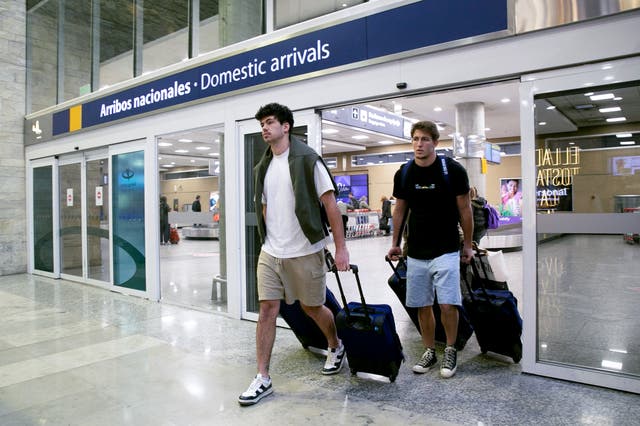 <p>French rugby players Oscar Jegou, right, and Hugo Auradou arrive from Mendoza at the airport in Buenos Aires</p>