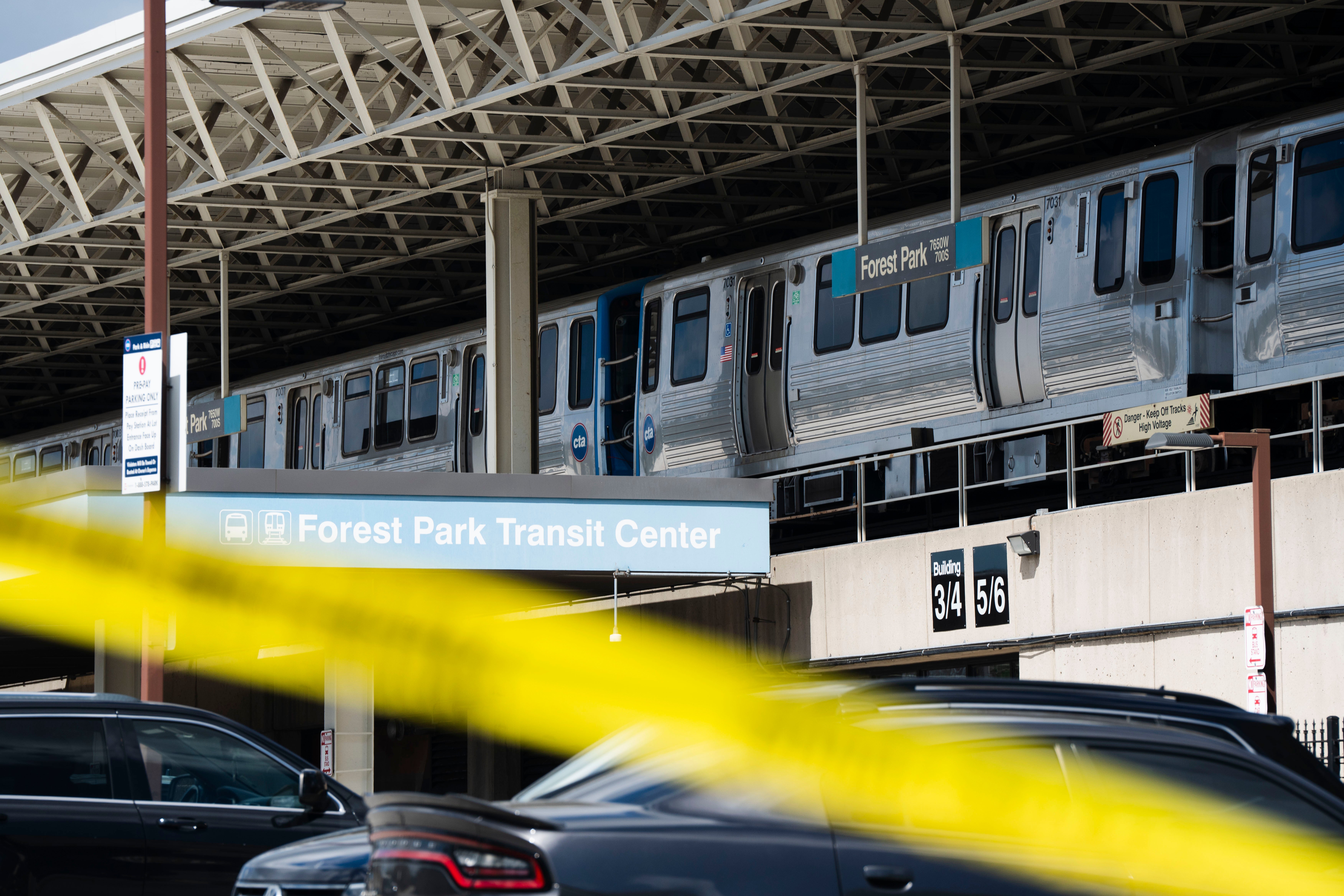 Police tape blocks off the Forest Park Blue Line train station. Four people were killed on a Blue Line train at the Forest Park station early Monday morning