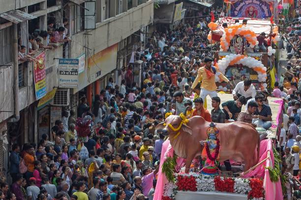 A tableau depicting the holy cow takes part in the annual religious procession on 20 June 2023