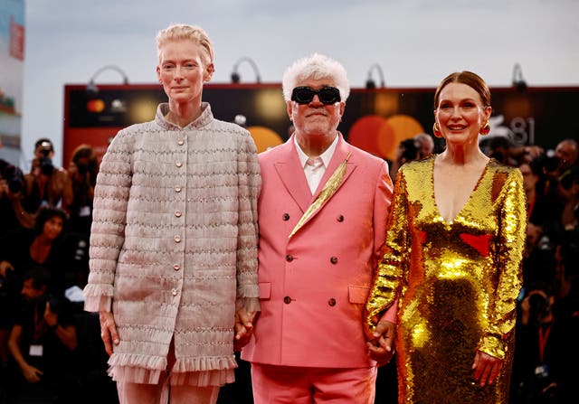 <p>Tilda Swinton, Pedro Almodovar and Julianne Moore pose on the red carpet during arrivals for the screening of the movie “The Room Next Door” at the Venice Film Festival</p>