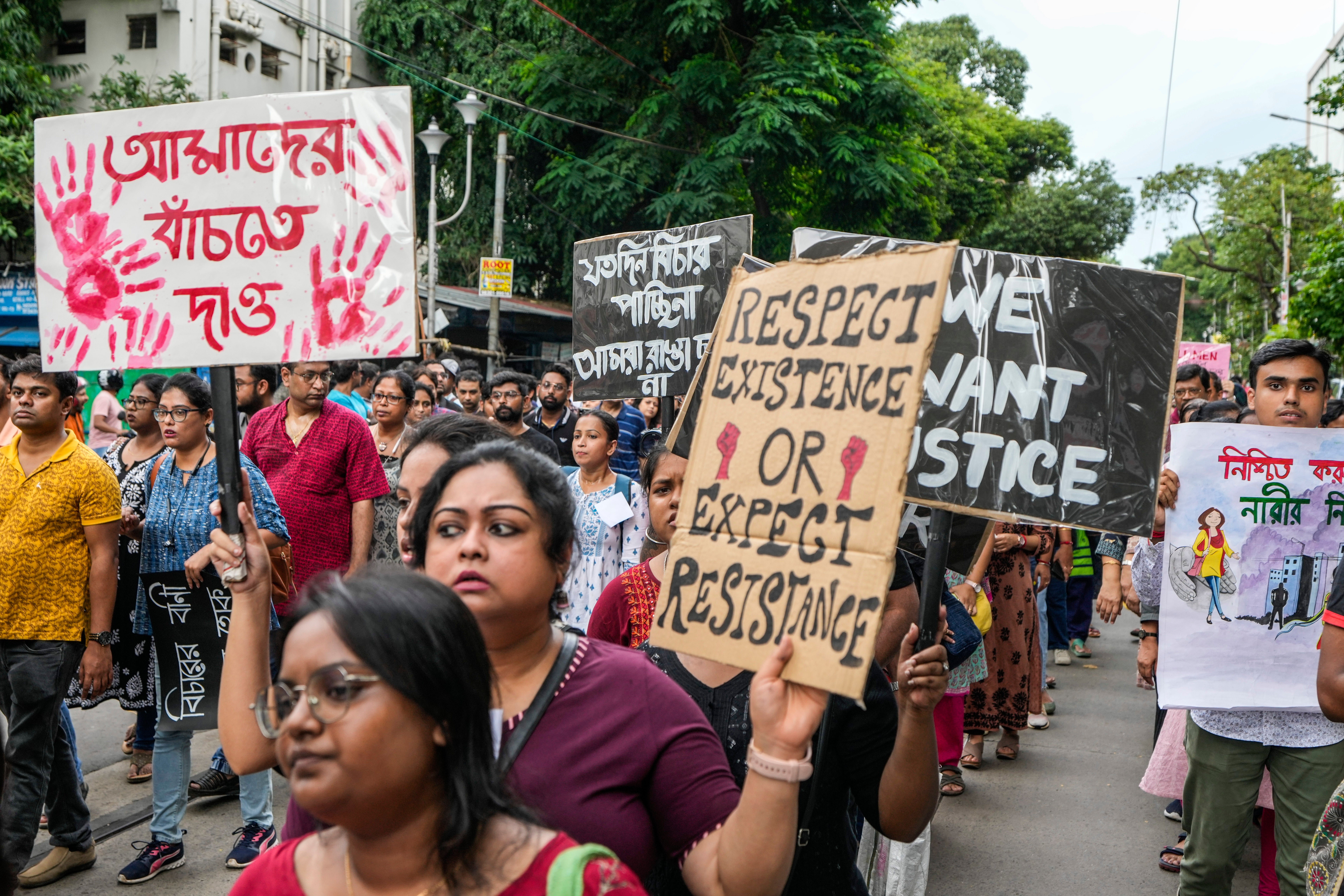 People take part in a protest against the rape and murder of a resident doctor in Kolkata