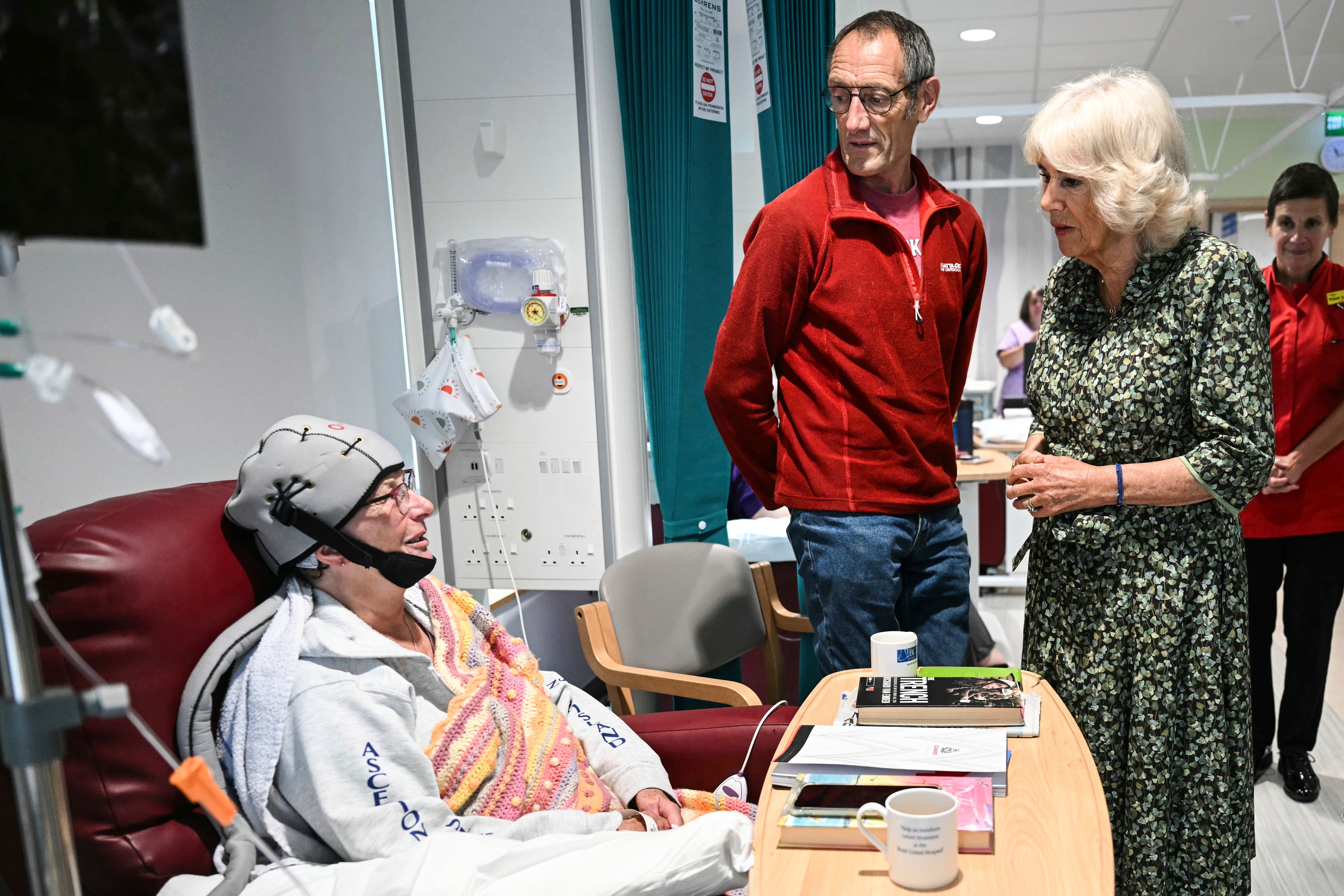 The queen spoke with cancer patients on her visit to open the new facility.