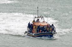 At least 12 migrants died after boat sank crossing Channel, coastguard says