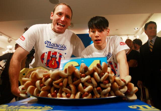 <p>Joey Chestnut and Takeru Kobayashi compete in a Labor Day hot dog eating contest </p>