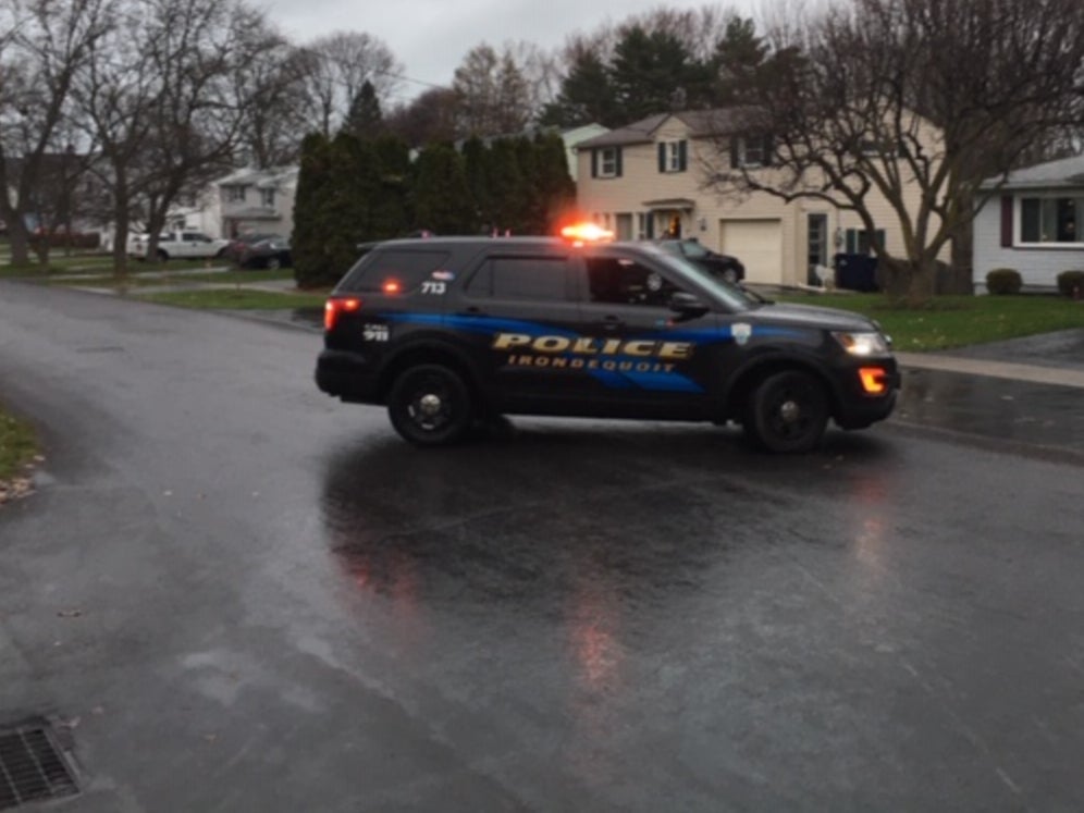 An Irondequoit, New York police cruiser is pictured on an unkown date. Investigators in Irondequoit are hunting for someone who killed a family of four but have yet to make an arrest.