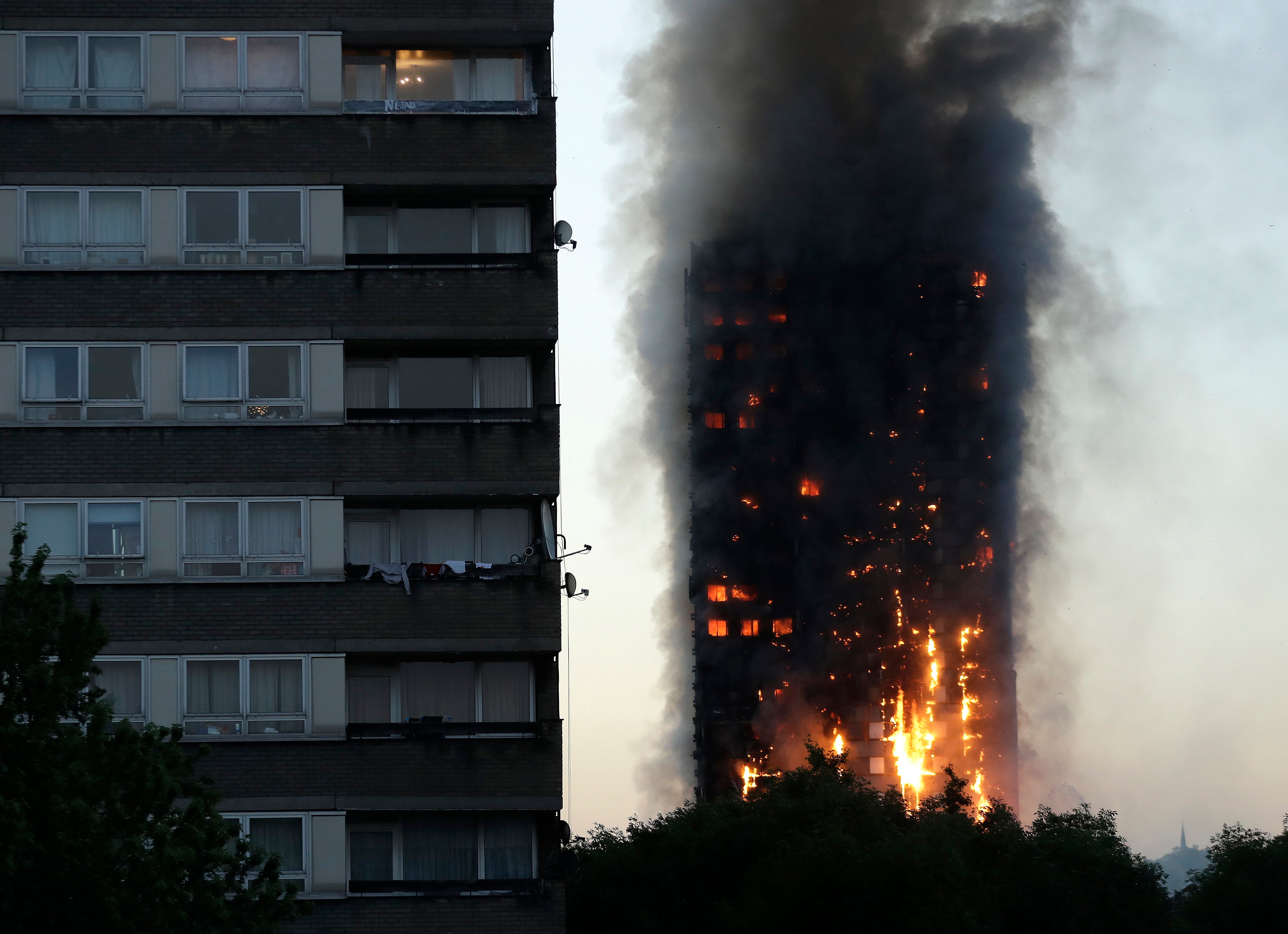 Smoke and flames rise from the Grenfell Tower high-rise building in west London, June 14