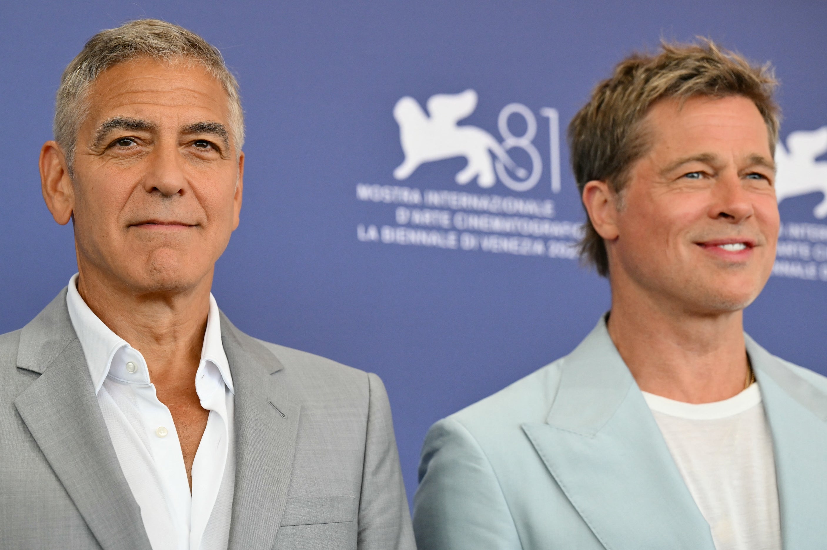 George Clooney (left) and Brad Pitt star in ‘Wolfs,’ which premiered at Venice Film Festival