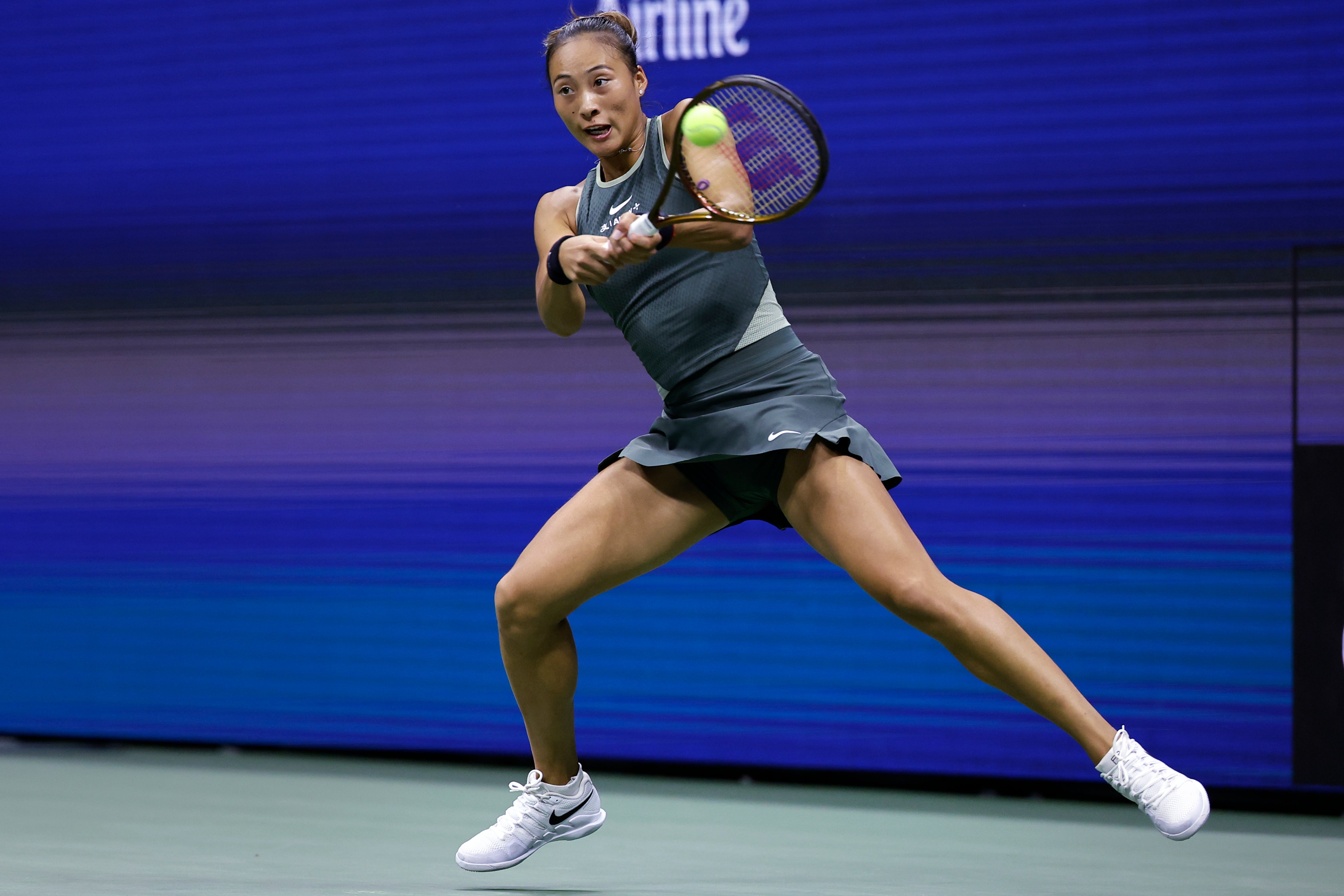 Zheng Qinwen, of China, returns to Aryna Sabalenka, of Belarus, during the quarterfinals of the U.S. Open tennis championships, Tuesday, Sept. 3, 2024, in New York. (AP Photo/Adam Hunger)