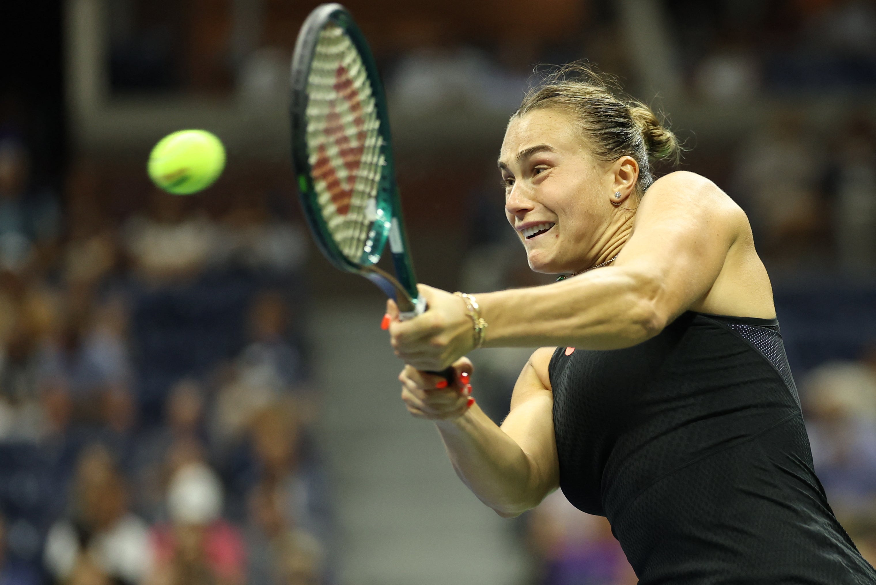 Belarus's Aryna Sabalenka hits a return to China's Zheng Qinwen during their women's quarterfinals match on day nine of the US Open tennis tournament at the USTA Billie Jean King National Tennis Center in New York City, on September 3, 2024. (Photo by CHARLY TRIBALLEAU / AFP) (Photo by CHARLY TRIBALLEAU/AFP via Getty Images)