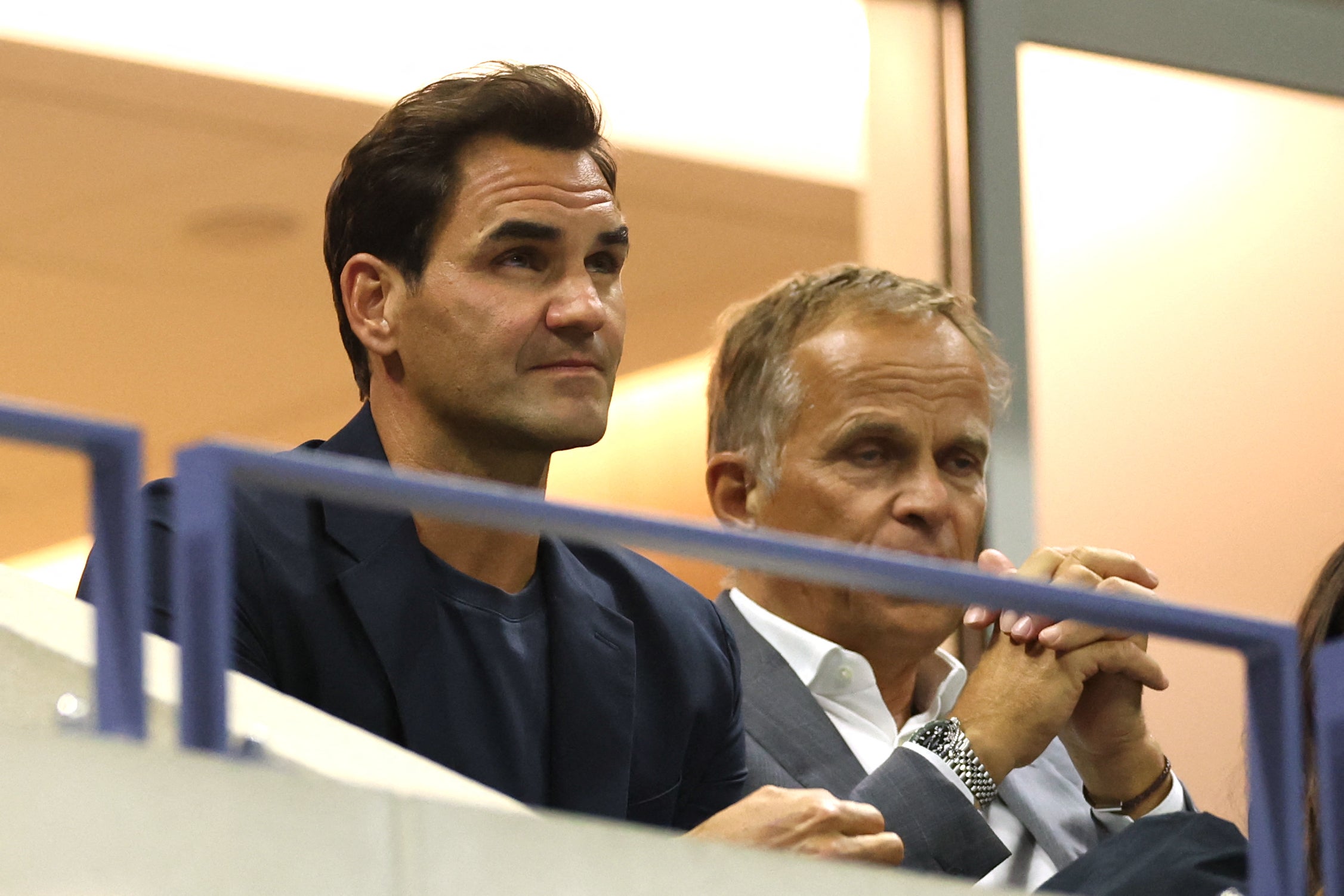 Swiss former professional tennis player Roger Federer (L) attends the women's quarterfinals match between Belarus's Aryna Sabalenka and China's Zheng Qinwen on day nine of the US Open tennis tournament at the USTA Billie Jean King National Tennis Center in New York City, on September 3, 2024. (Photo by CHARLY TRIBALLEAU / AFP) (Photo by CHARLY TRIBALLEAU/AFP via Getty Images)