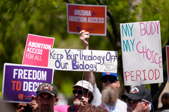 <p>Abortion rights supporters gather outside in Phoenix in April. Most swing state Republicans and Democrats oppose criminalizing abortion, poll finds</p>