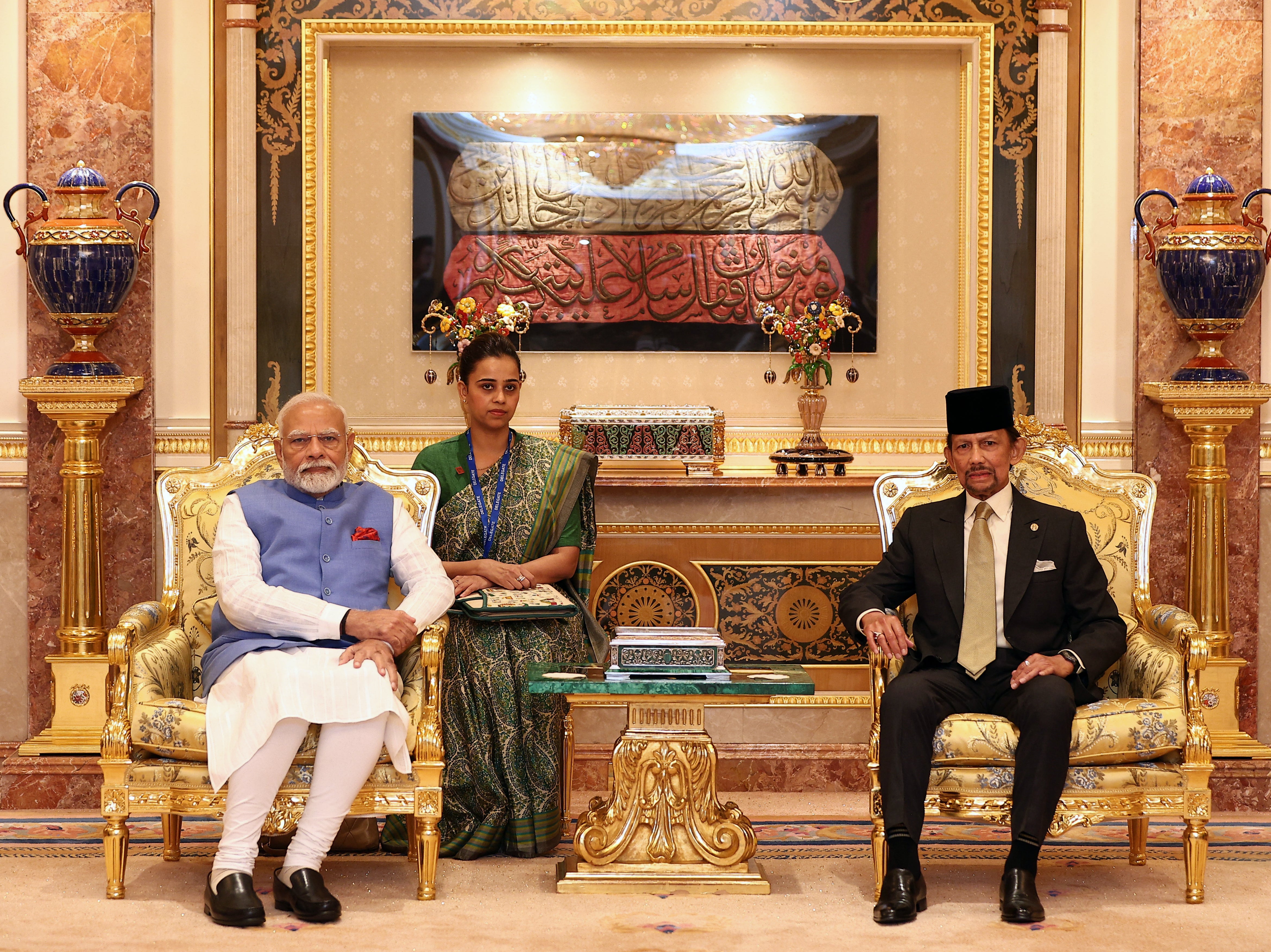 India’s prime minister Narendra Modi (L) and Brunei Sultan Hassanal Bolkiah (R) pose for pictures prior to a meeting at Istana Nurul Iman in Bandar Seri Begawan on 4 September 2024