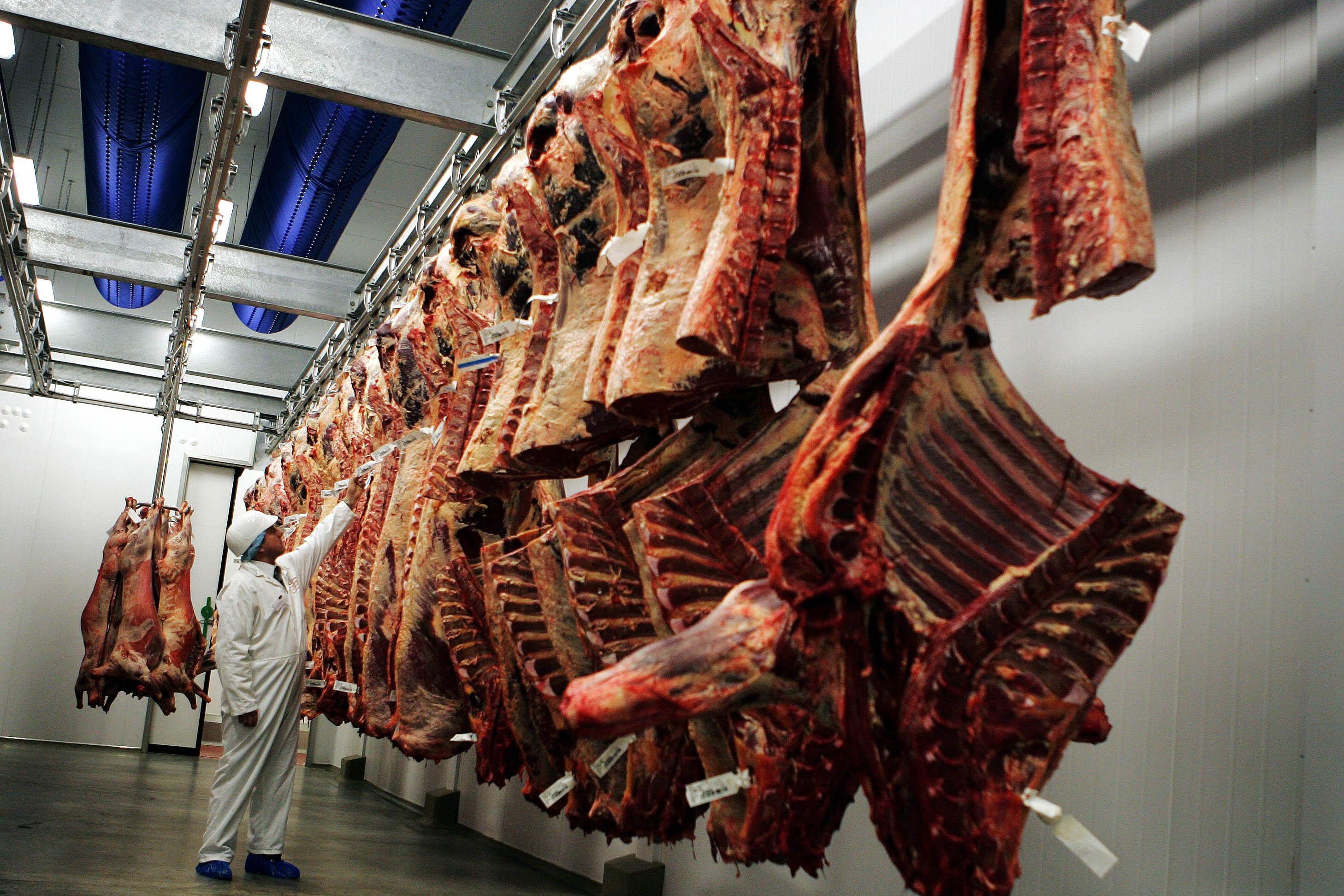 A man in the chiller room at the Lathallan abattoir in Linlithgow, Scotland (Andrew Milligan/PA)