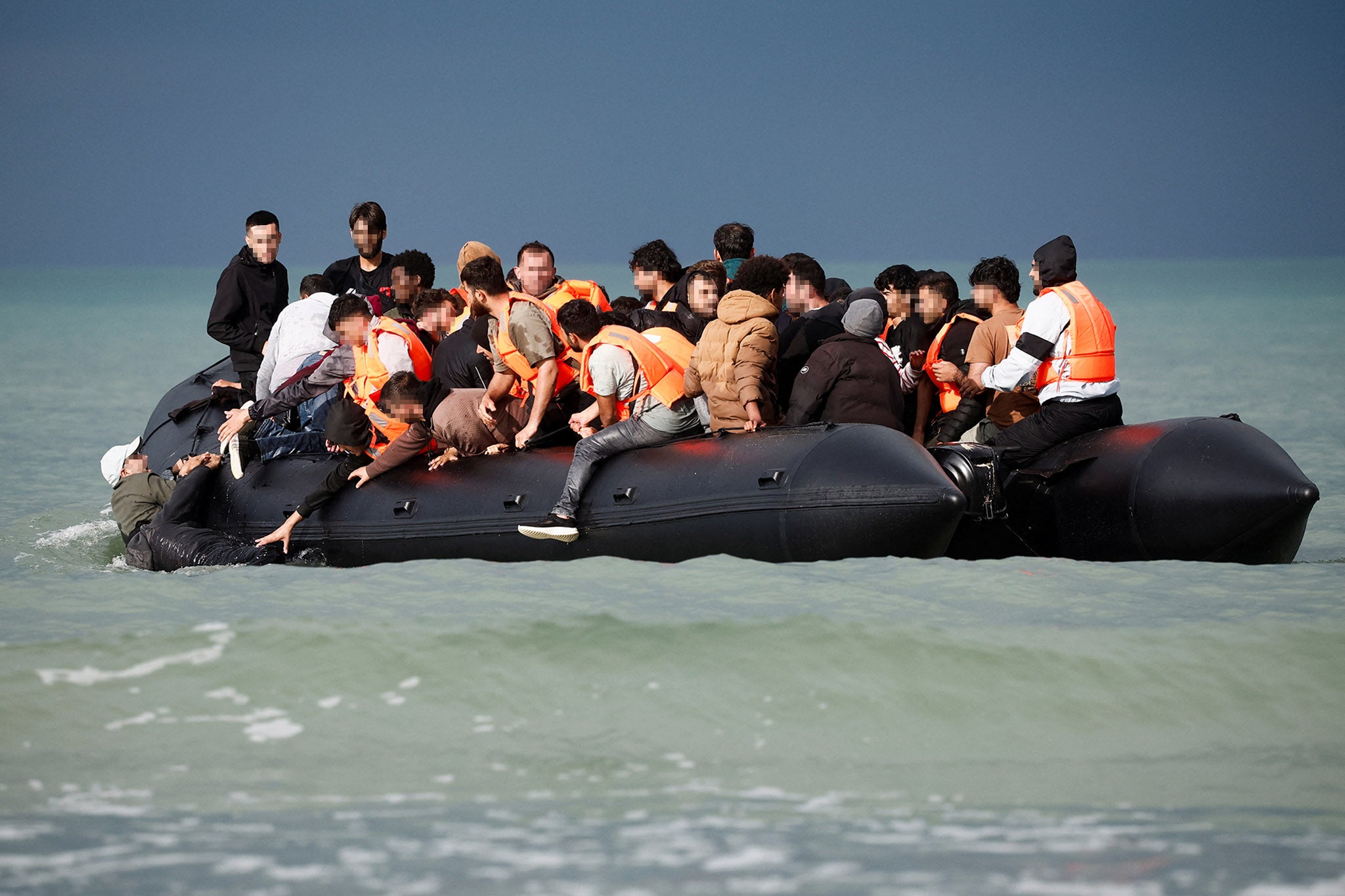 Migrants on an inflatable dinghy attempt to cross the Channel from the Slack dunes in Wimereux, earlier this month