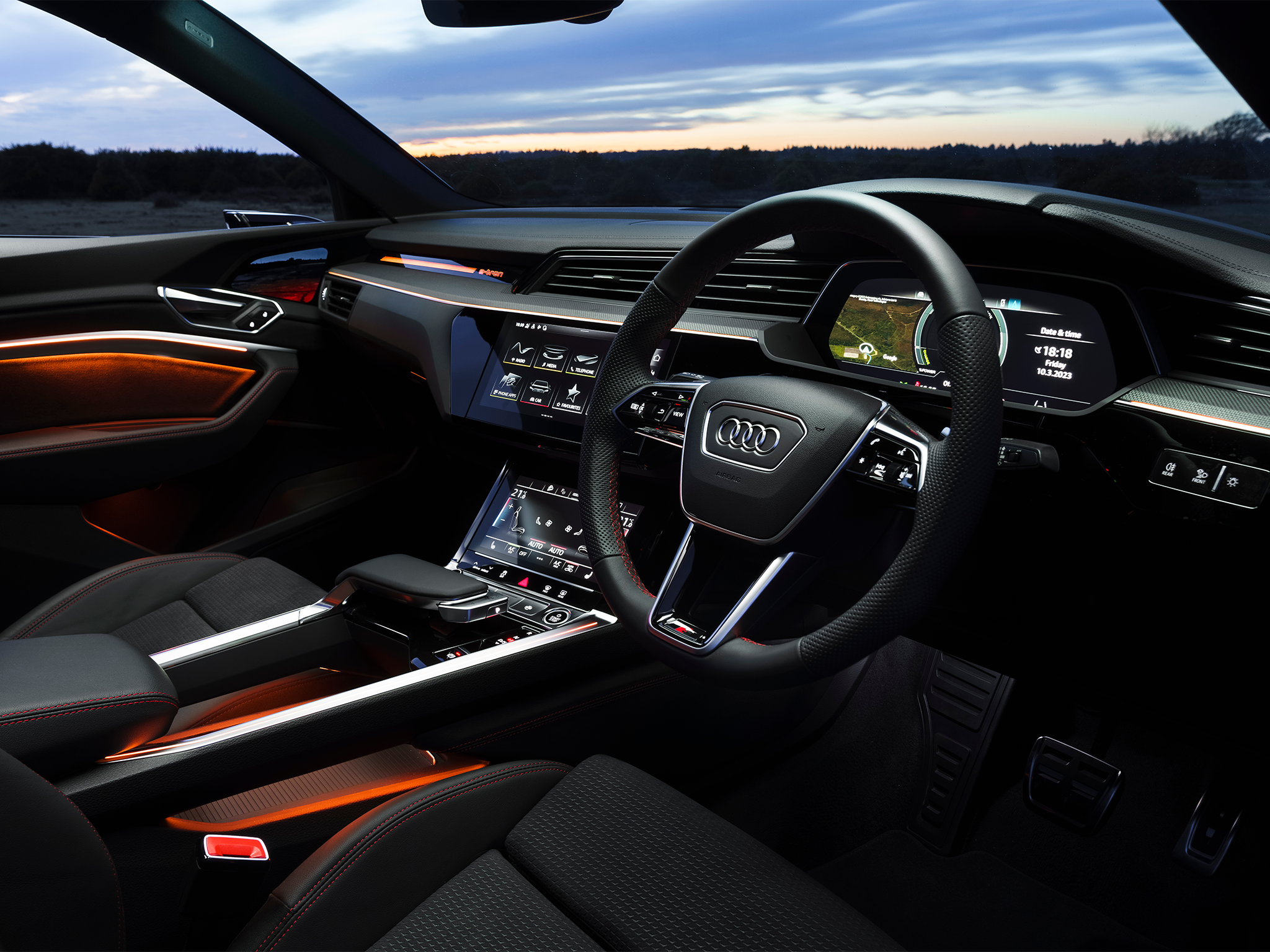 The Audi Q8 e-tron Sportback’s upper 10.1-inch and lower 8.6-inch screens replace virtually all the buttons inside