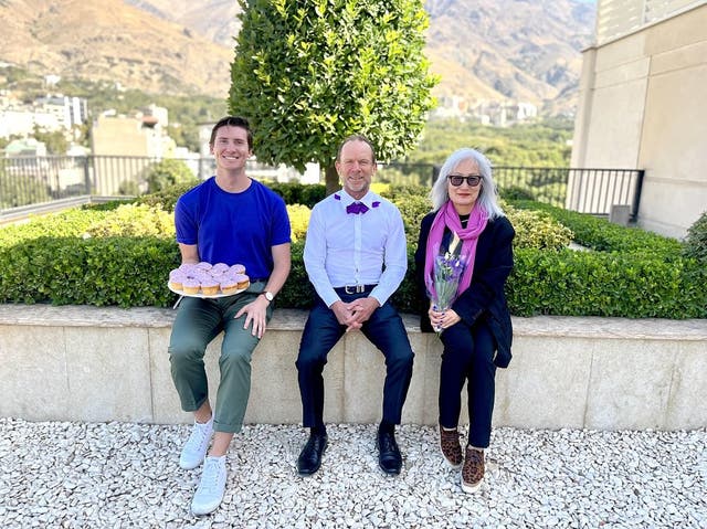 <p>Pictures posted by Australia’s embassy in Iran showed the ambassador holding purple flowers and wearing a puple bow tie</p>