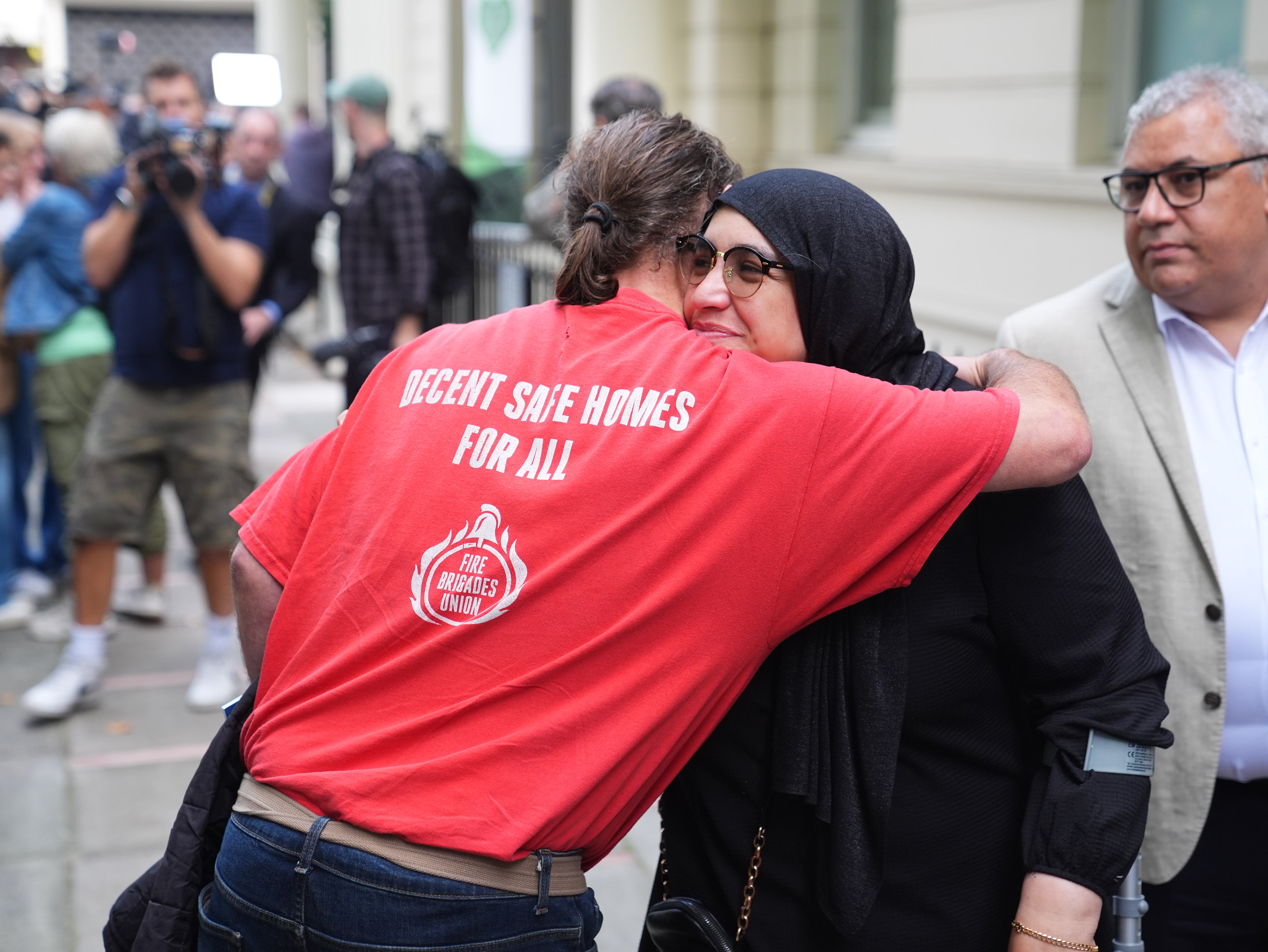 People leave Dorland House in London after the publication of the the final report of the Grenfell Tower Inquiry