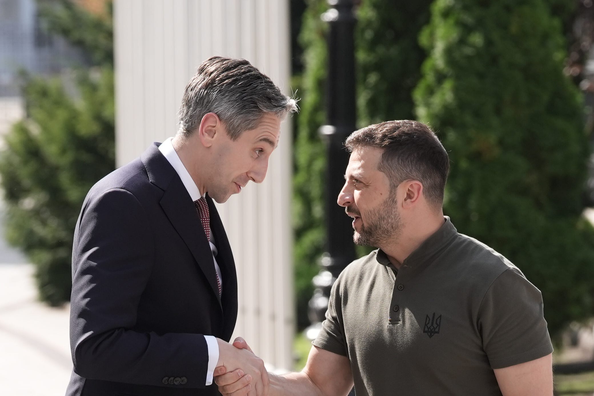 Taoiseach Simon Harris shakes hands with Ukrainian President Volodymyr Zelensky outside Horodetskyi House (Stefan Rousseau/PA)