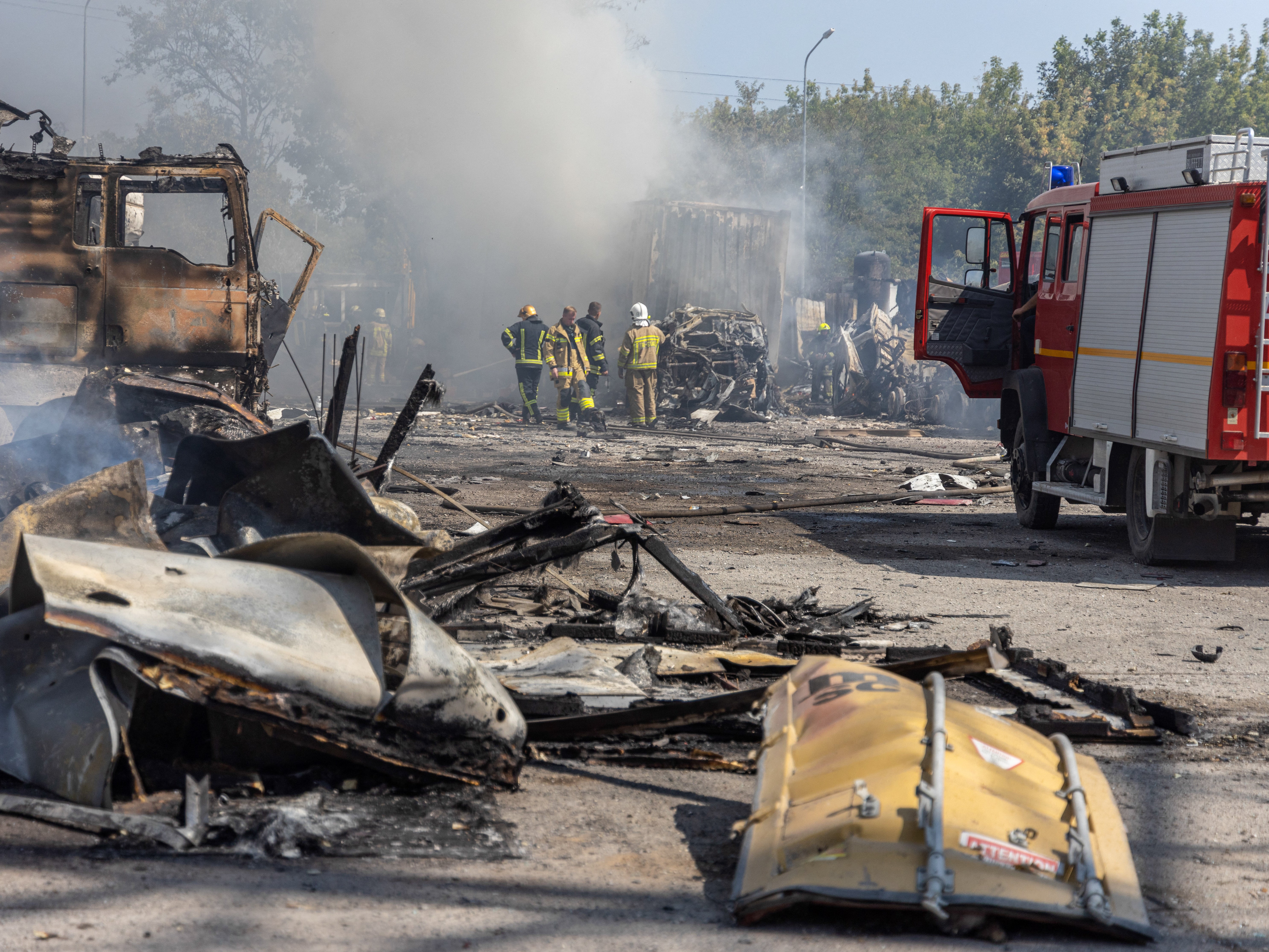 Firefighters extinguish a fire following an air attack in the Odesa region