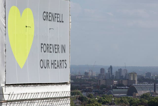 Grenfell Tower covered in plastic sheeting one year after the blaze (/PA)