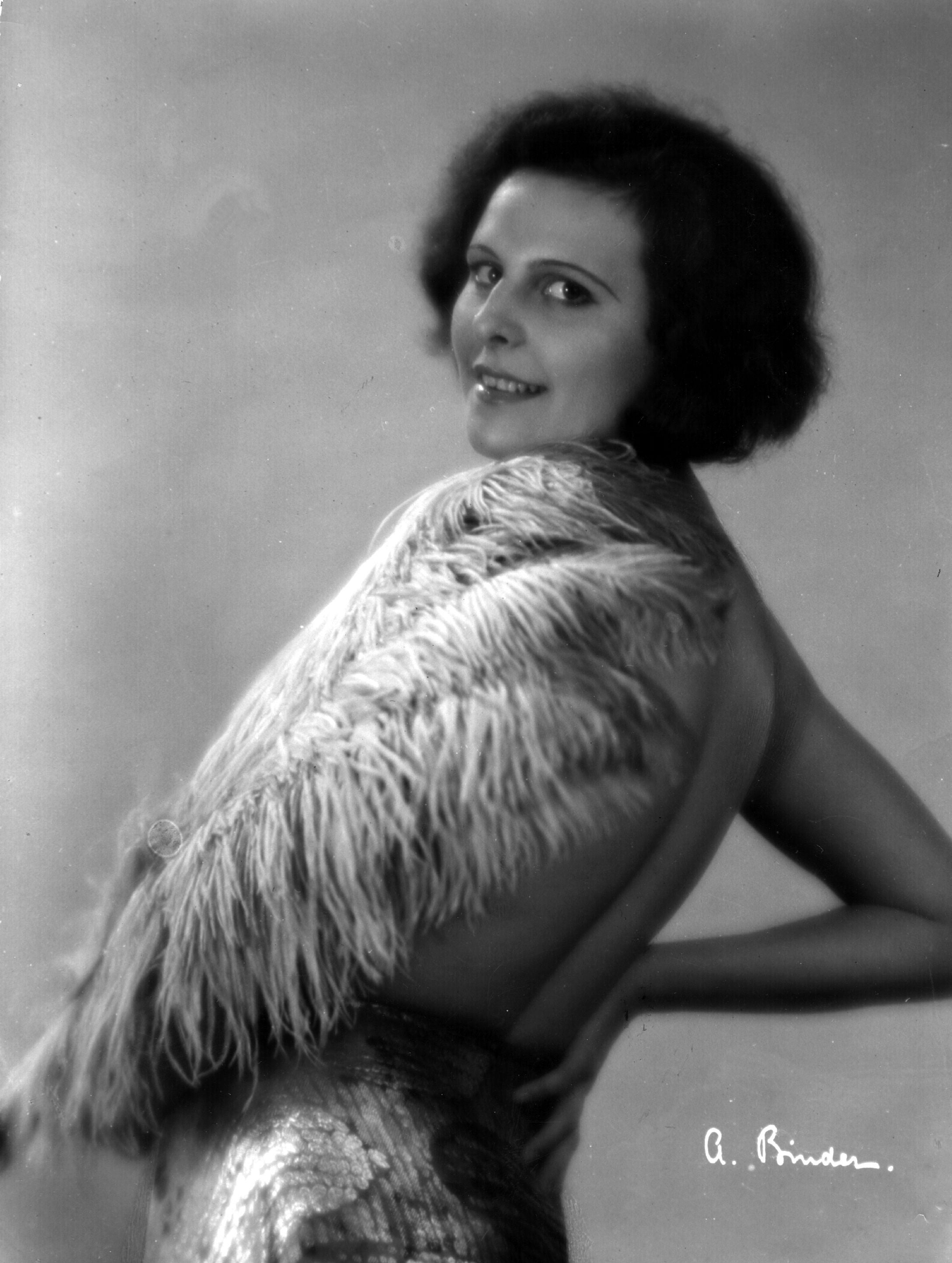 A young Riefenstahl wearing a feather boa