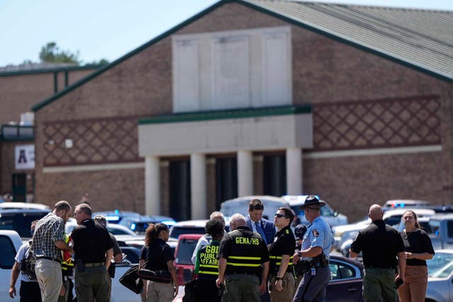 <p>Police gather outside Apalachee High School after a shooting at the school Wednesday, Sept. 4, 2024. </p>