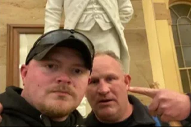 <p>Jacob Fracker and Thomas Robertson were at the Capitol on January 6, 2021. He has had his sentence reduced after a Supreme Court ruling. </p>