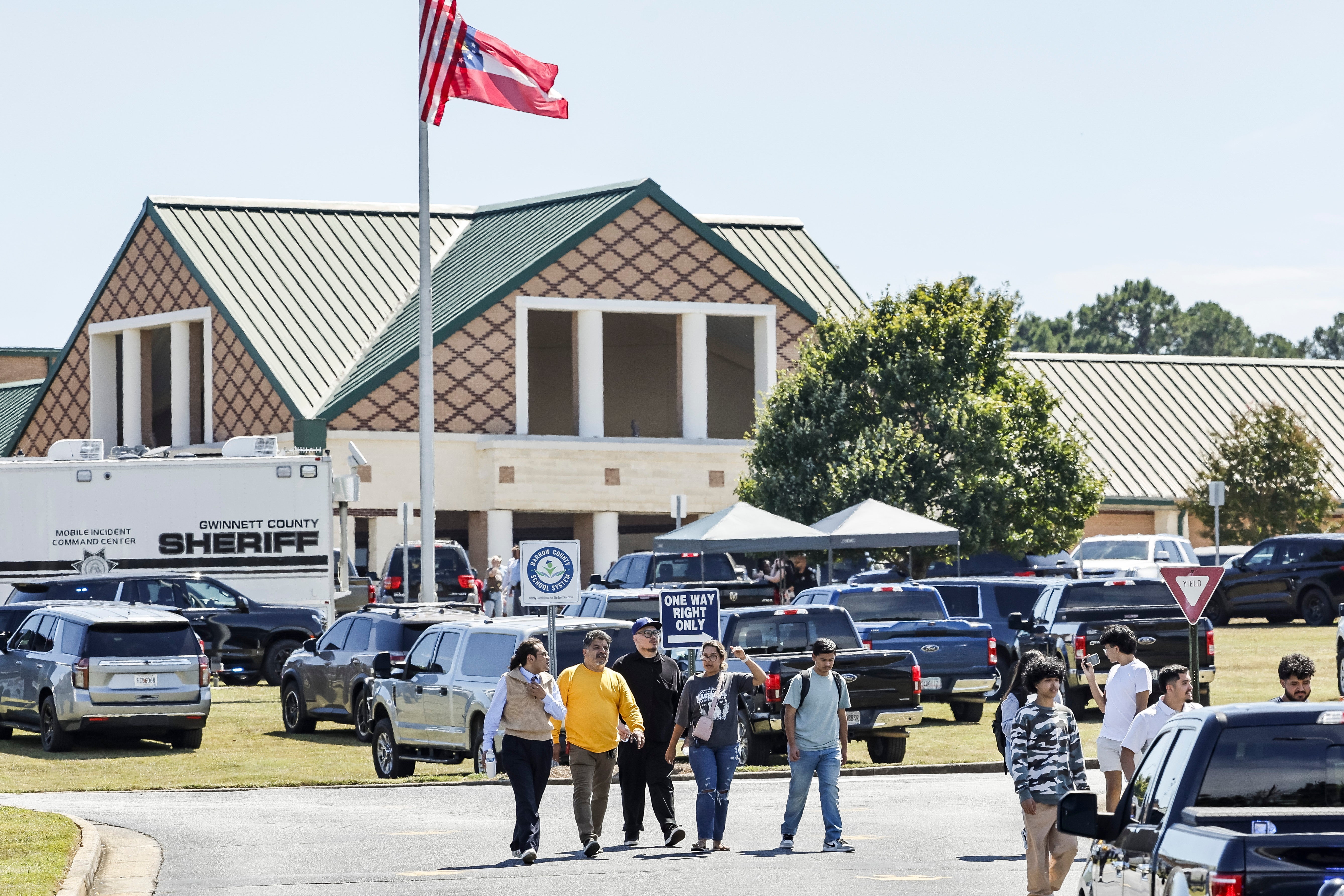 People leave the scene of a shooting at Apalachee High School in Winder, Georgia on September 4