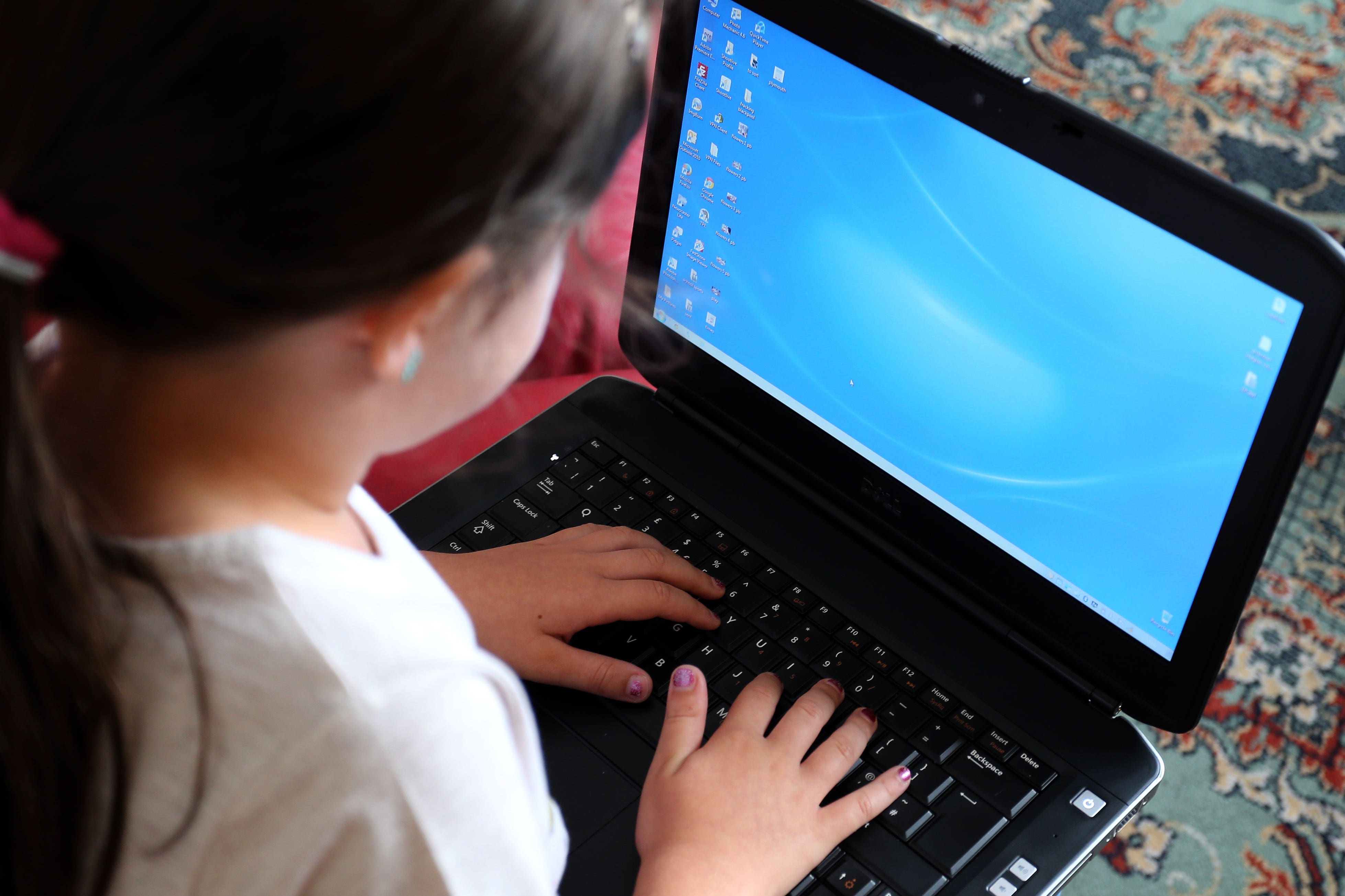 Children were reported to be spending 23.2 hours online each week (Peter Byrne/PA)