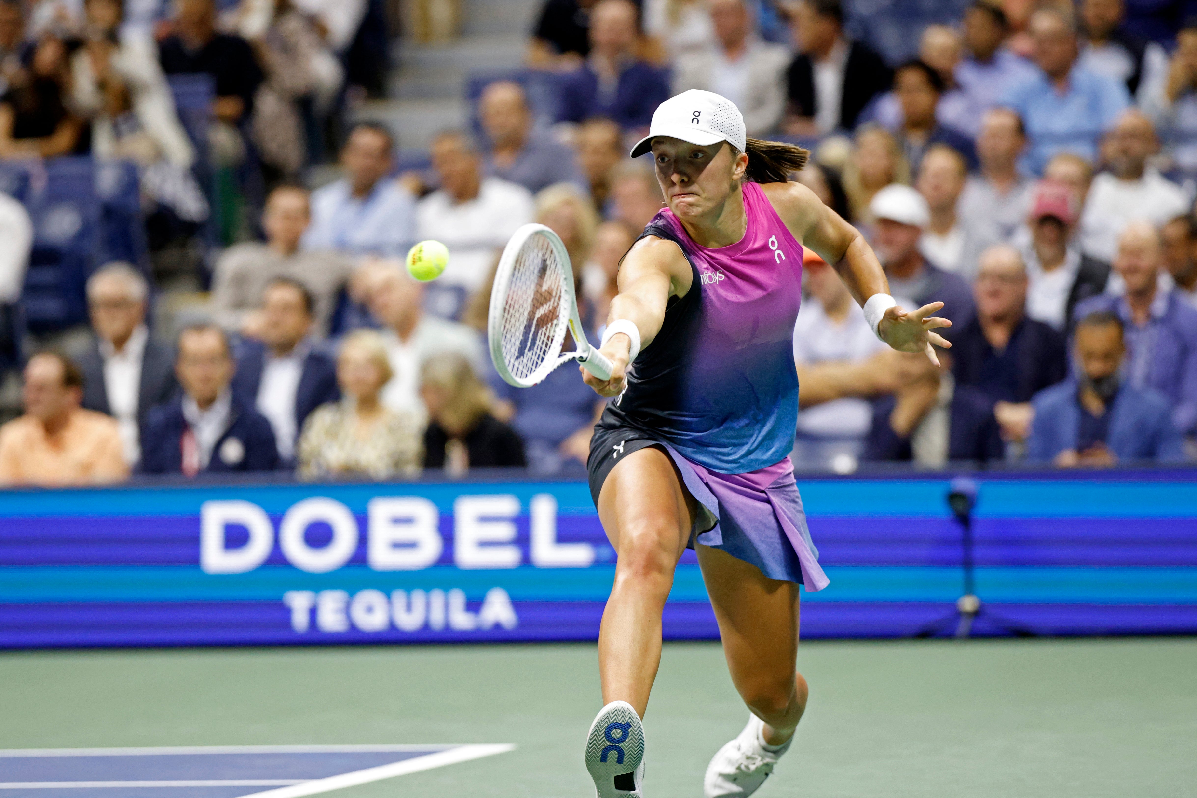 Poland's Iga Swiatek plays a backhand return against American Jessica Pegula during their women's quarterfinal match on day ten of the US Open tennis tournament at the USTA Billie Jean King National Tennis Center in New York City, September 4, 2024. (Photo by KENA BETANCUR / AFP) (Photo by KENA BETANCUR/AFP via Getty Images)