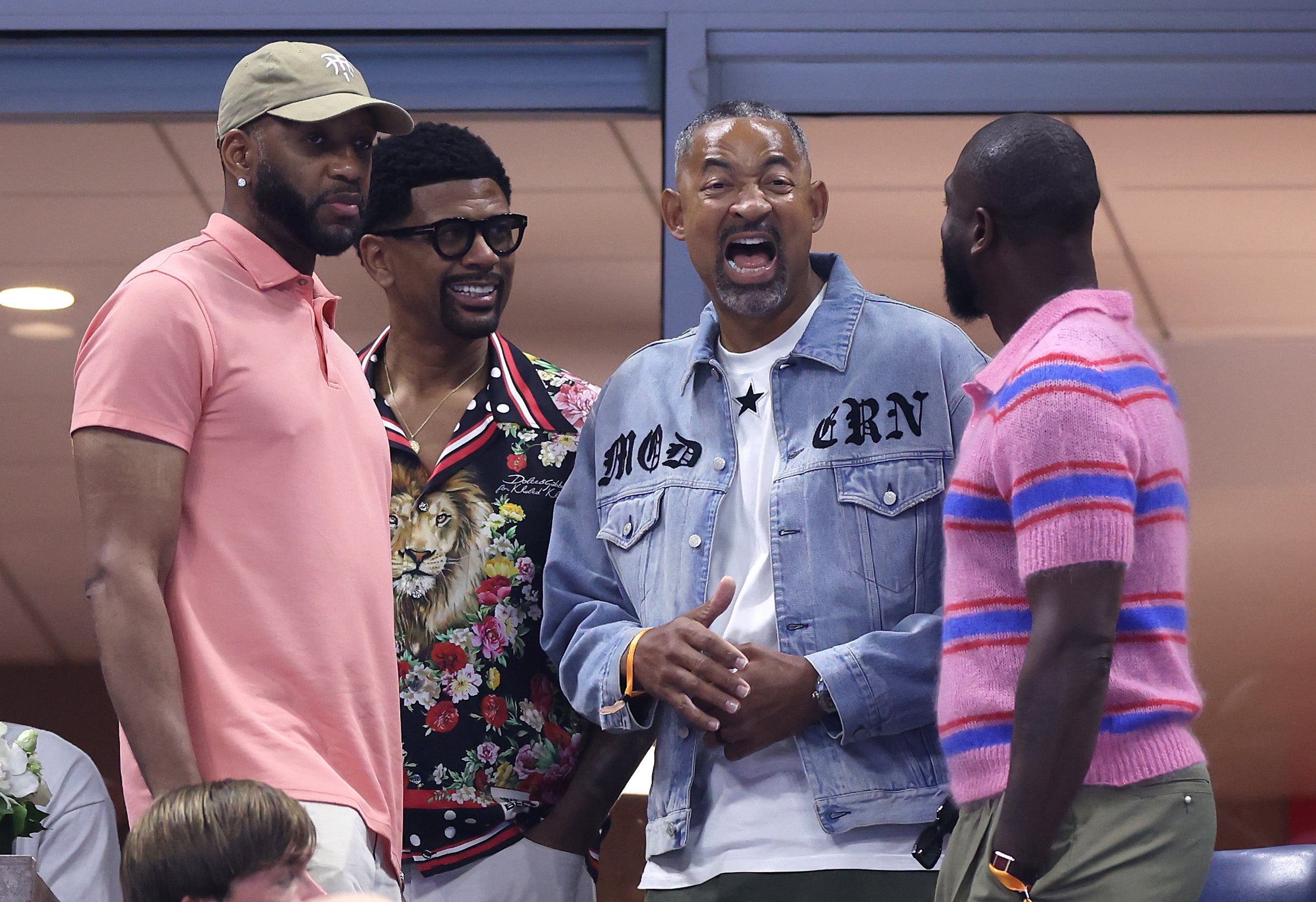 Basketball legends Tracy McGrady, Jalen Rose, Juwan Howard and Dwayne Wade watch the women's quarterfinals