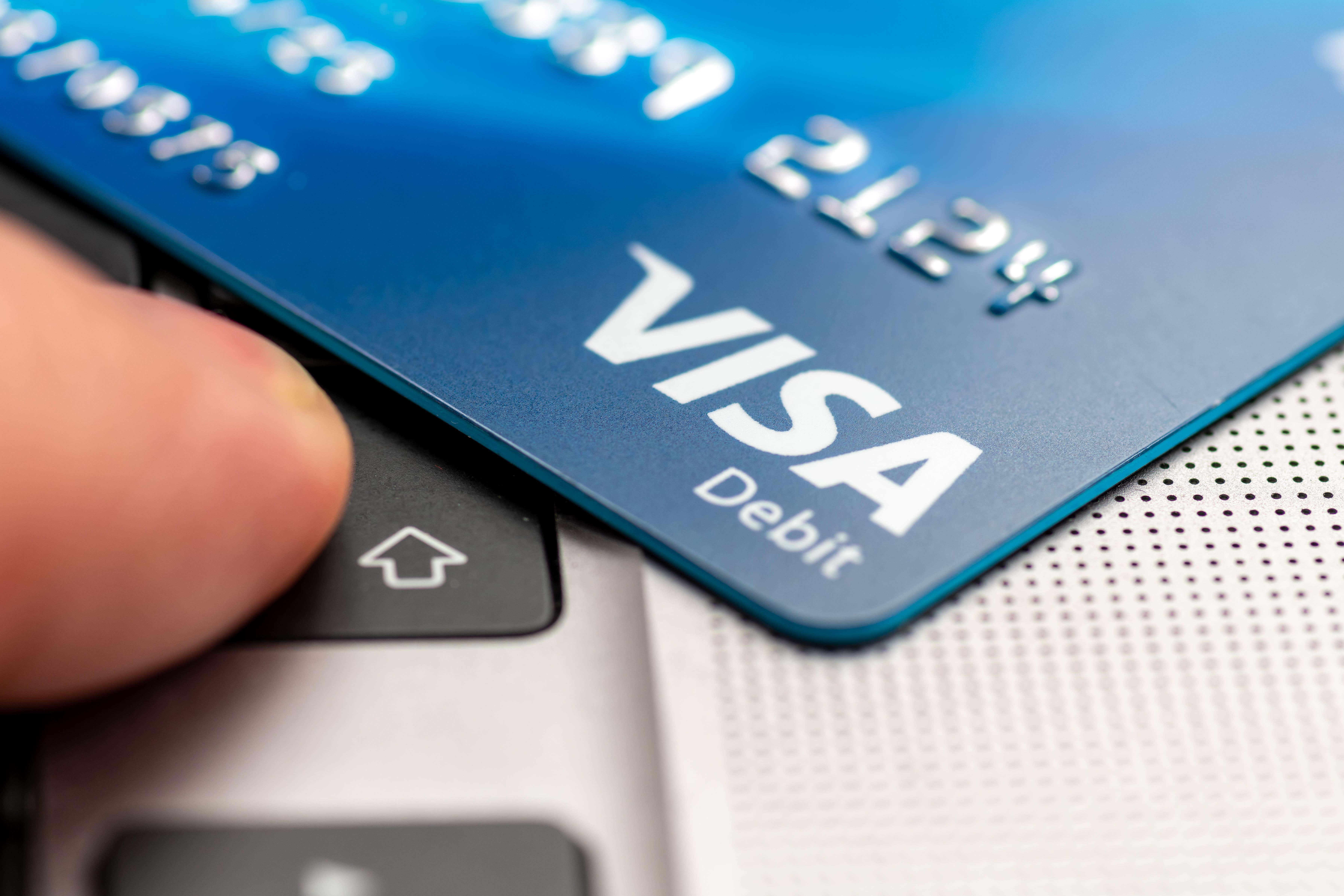 Visa has said it will launch an initiative to help boost consumer protections when people pay bills by bank transfer (Alamy/PA)