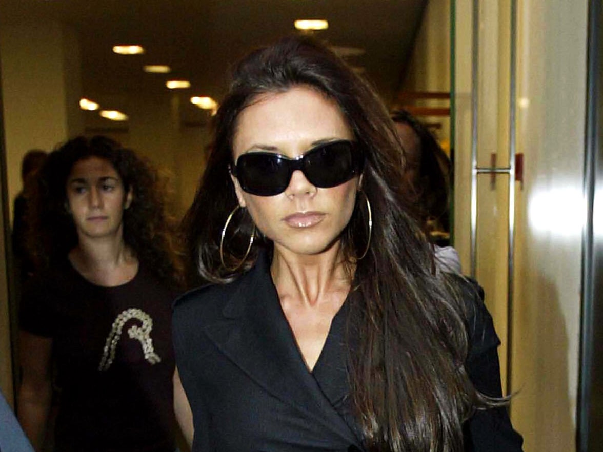 LONDON - SEPTEMBER 18:  Victoria Beckham leaves Dolce & Gabbana clothes store September 18, 2003 in Central London. (Photo by Gareth Cattermole/Getty Images)