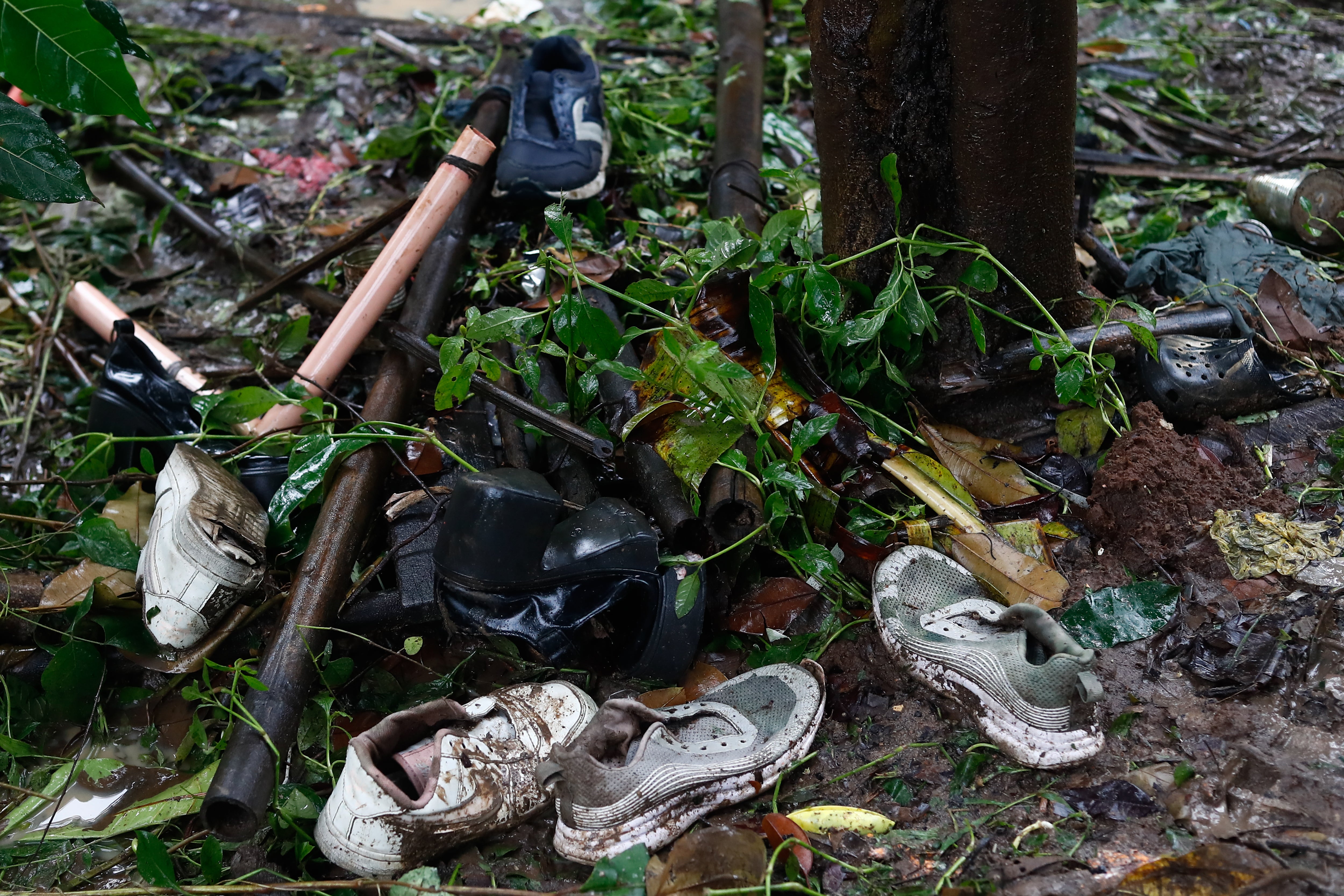 Shoes are seen near a site that has seen three people missing following a flood, as Typhoon Yagi (Enteng) bringing heavy rains and strong winds hit the country, in the mountainous area of Antipolo, Rizal, The Philippines